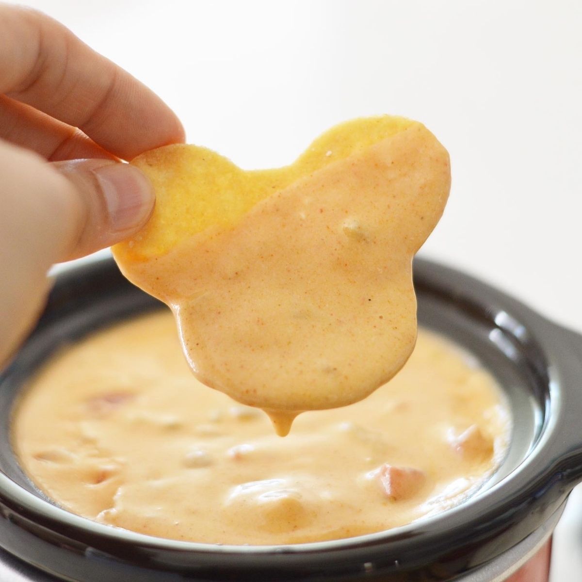 This homemade Queso Dip Recipe is made with real cheese and is so creamy with just the right amount of spice.  Perfect for your next football game or party.  