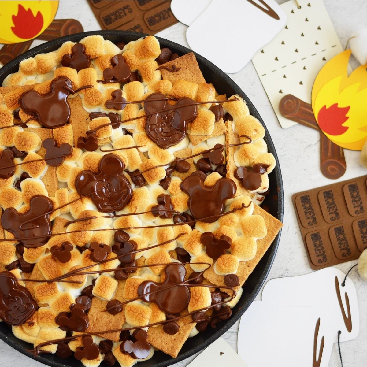 These S'mores Nachos are so easy to make.  Graham crackers, chocolate chips and marshmallows are the only ingredients you need to make this fun, summer treat.