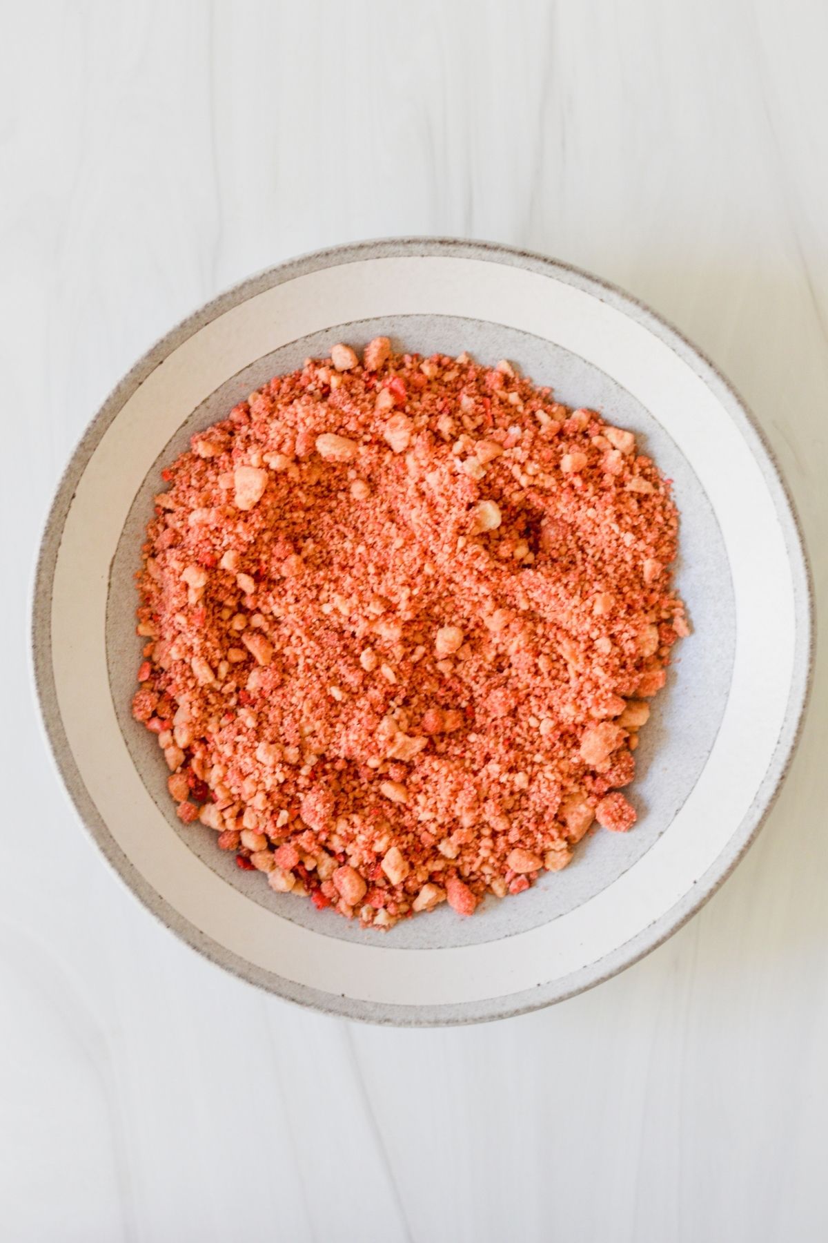 Strawberry crunch topping is made with freeze dried strawberries, shortbread cookies, strawberry JELLO and melted butter.