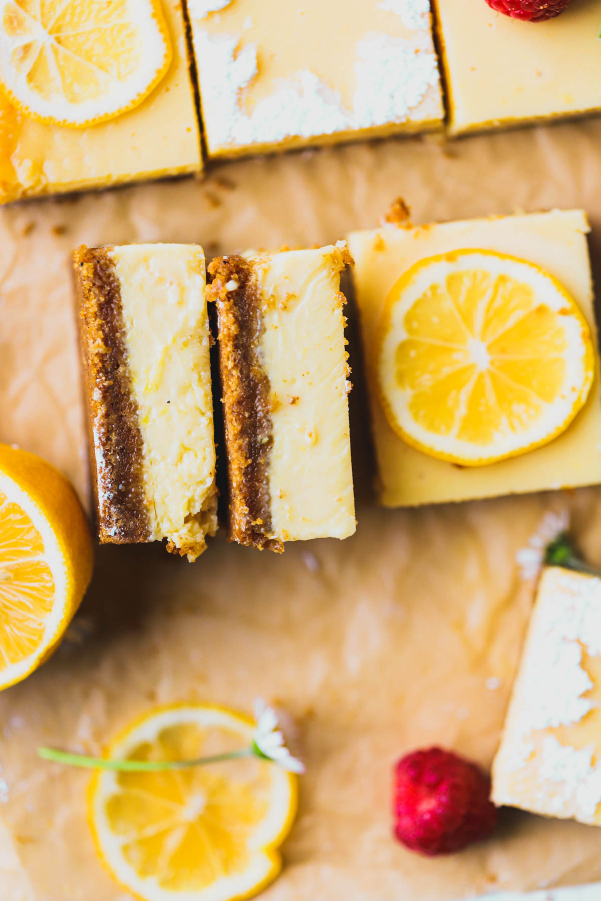 Sliced lemon bar squares dusted with powdered sugar.