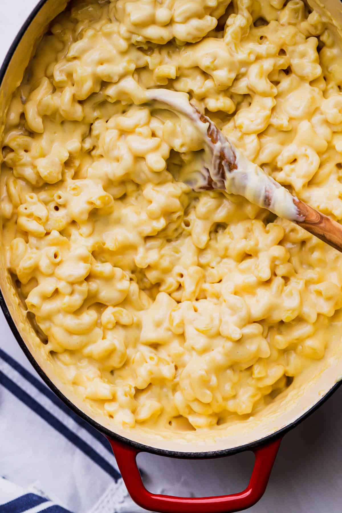 Cooked macaroni tossed with cheese sauce.