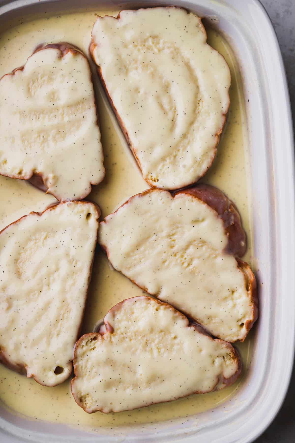 Challah bread coated with vanilla bean custard.