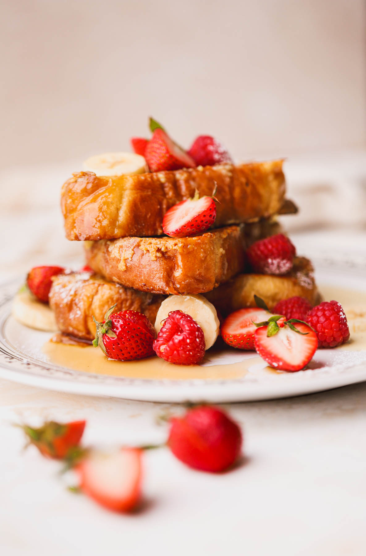 Crispy custard French toast drizzled with maple syrup and fresh fruit.
