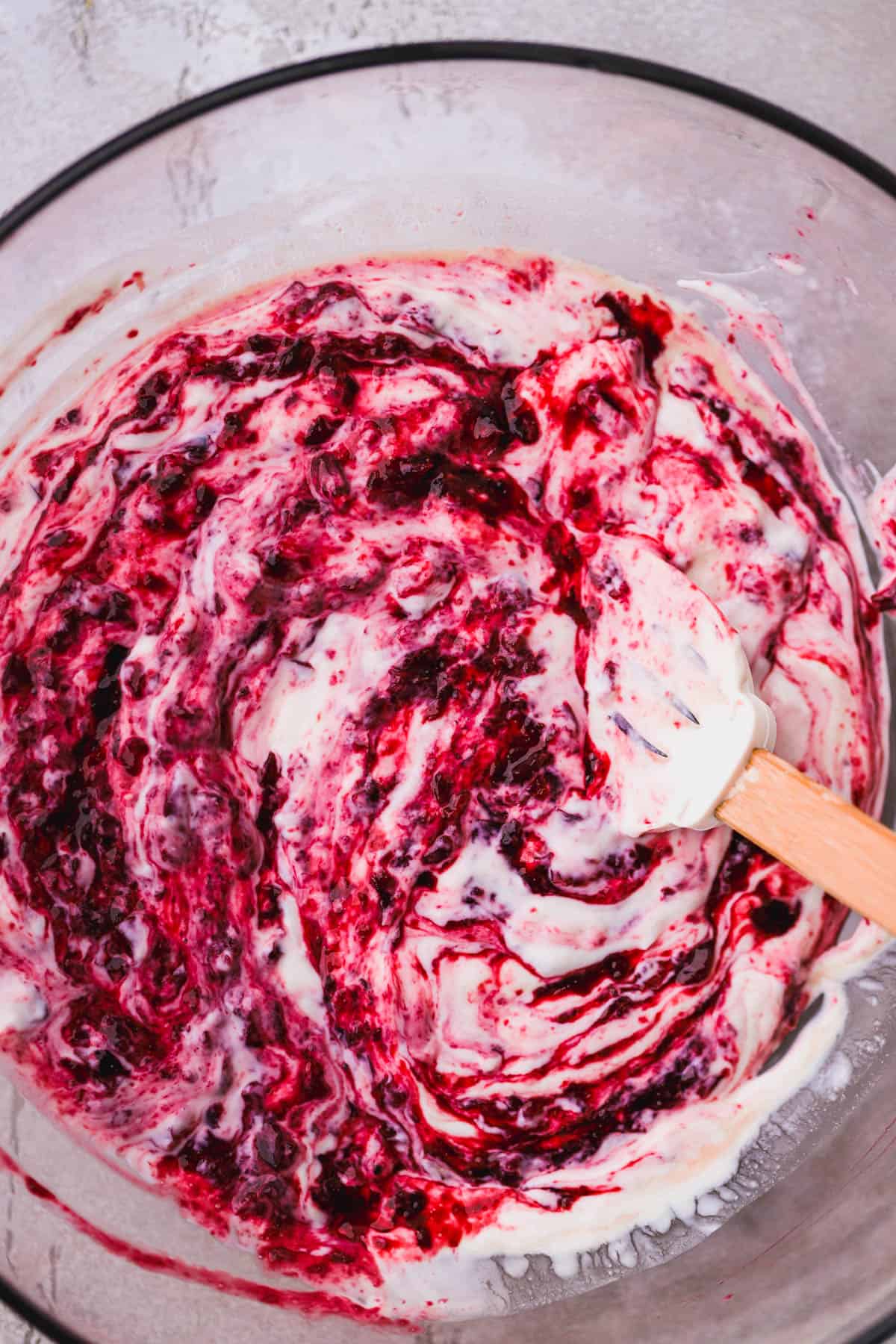 Swirls of bing cherry compote with coconut yogurt.  