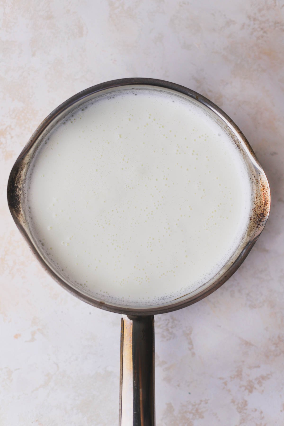 Heated milk in saucepan.