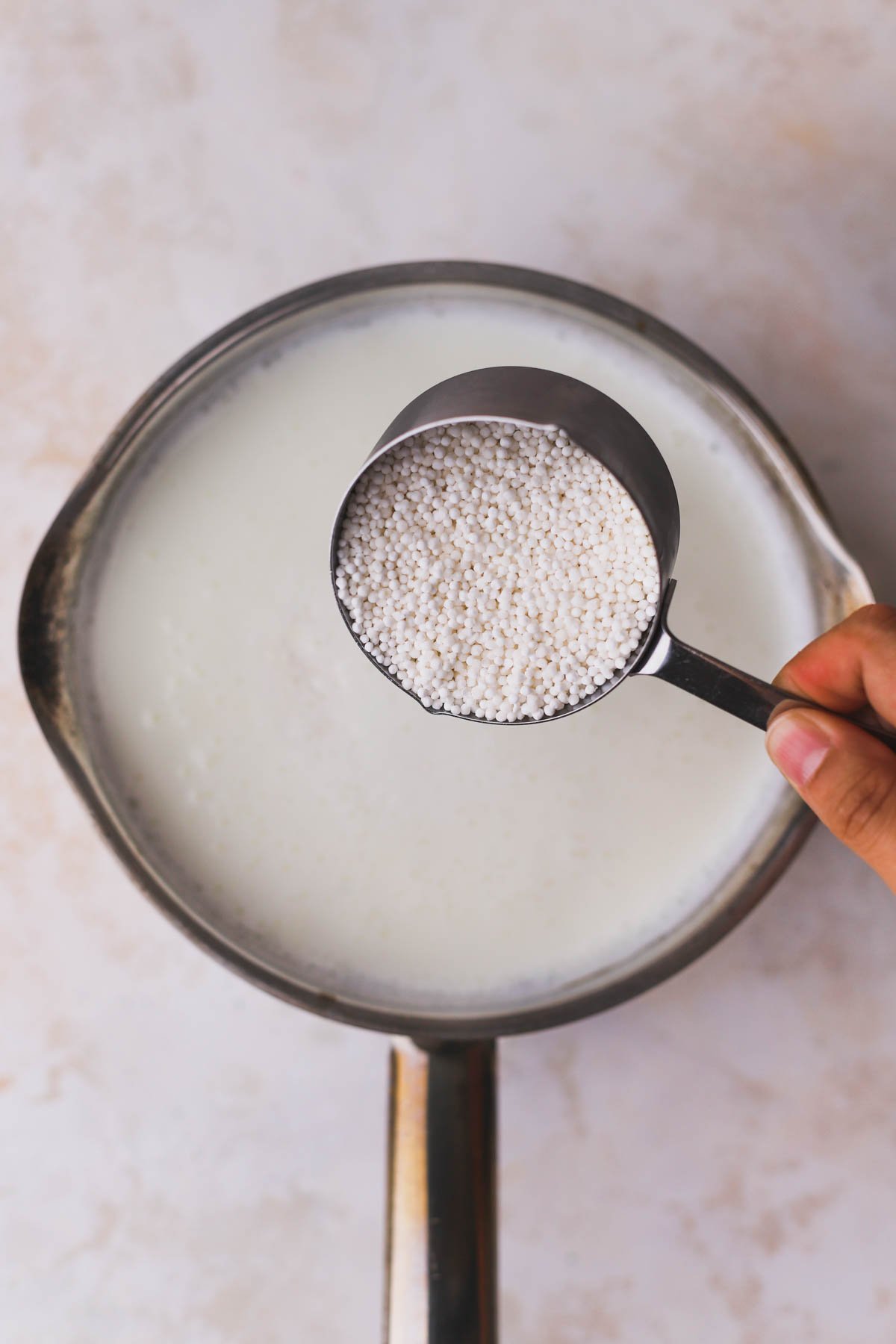 Tapioca pearls added to heated milk.