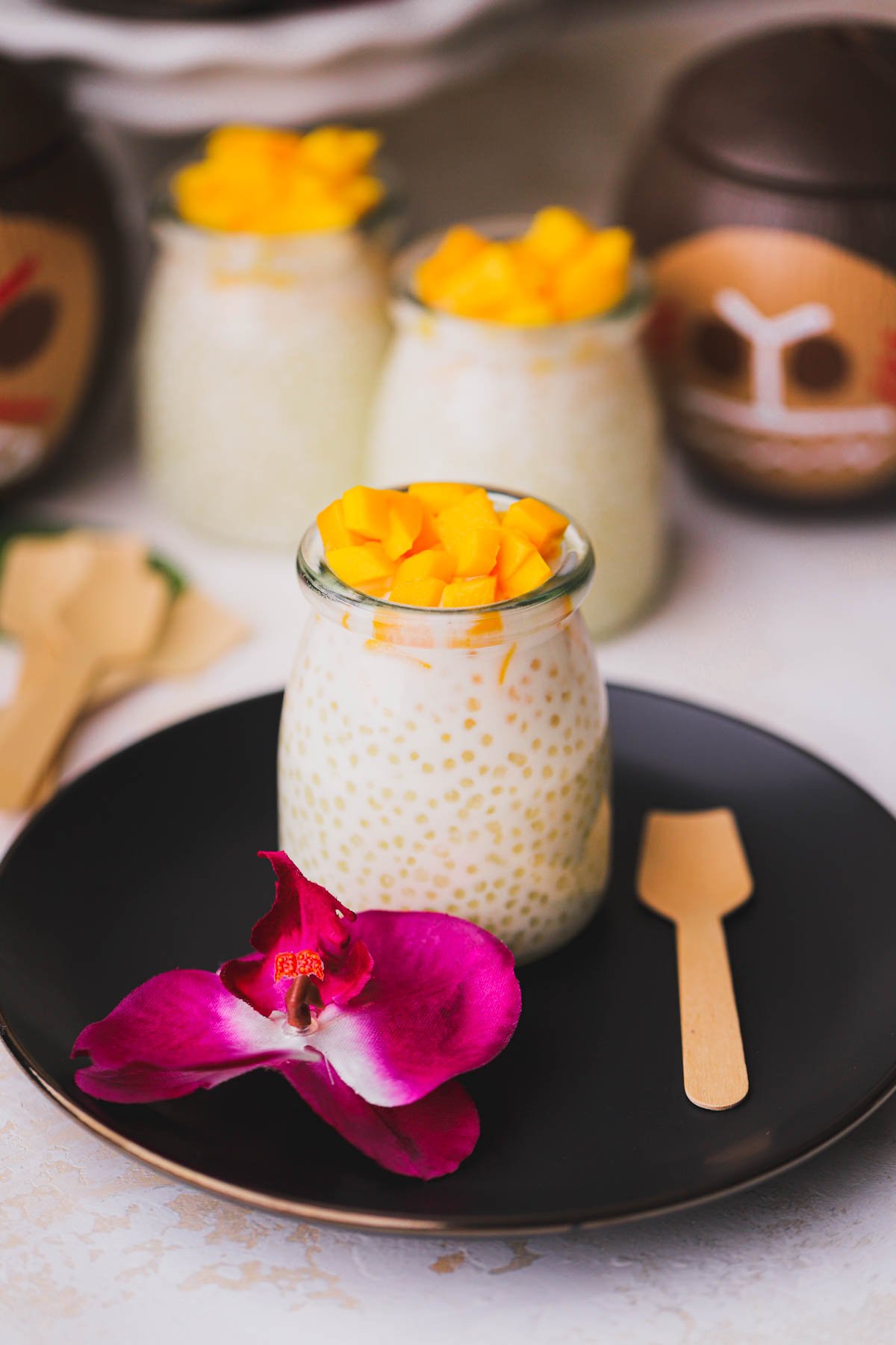 Miniature glasses filled with coconut tapioca pudding.  