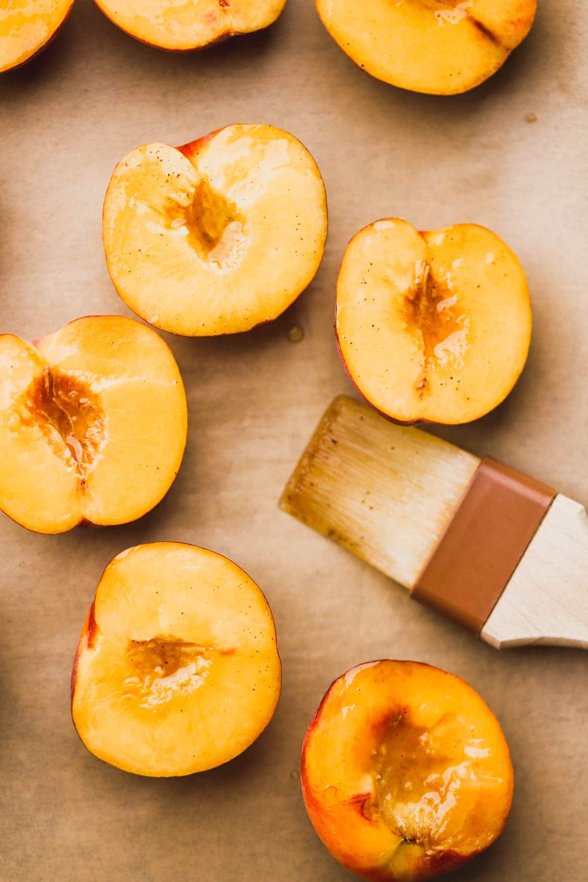 Halved peaches brushed with brown butter.