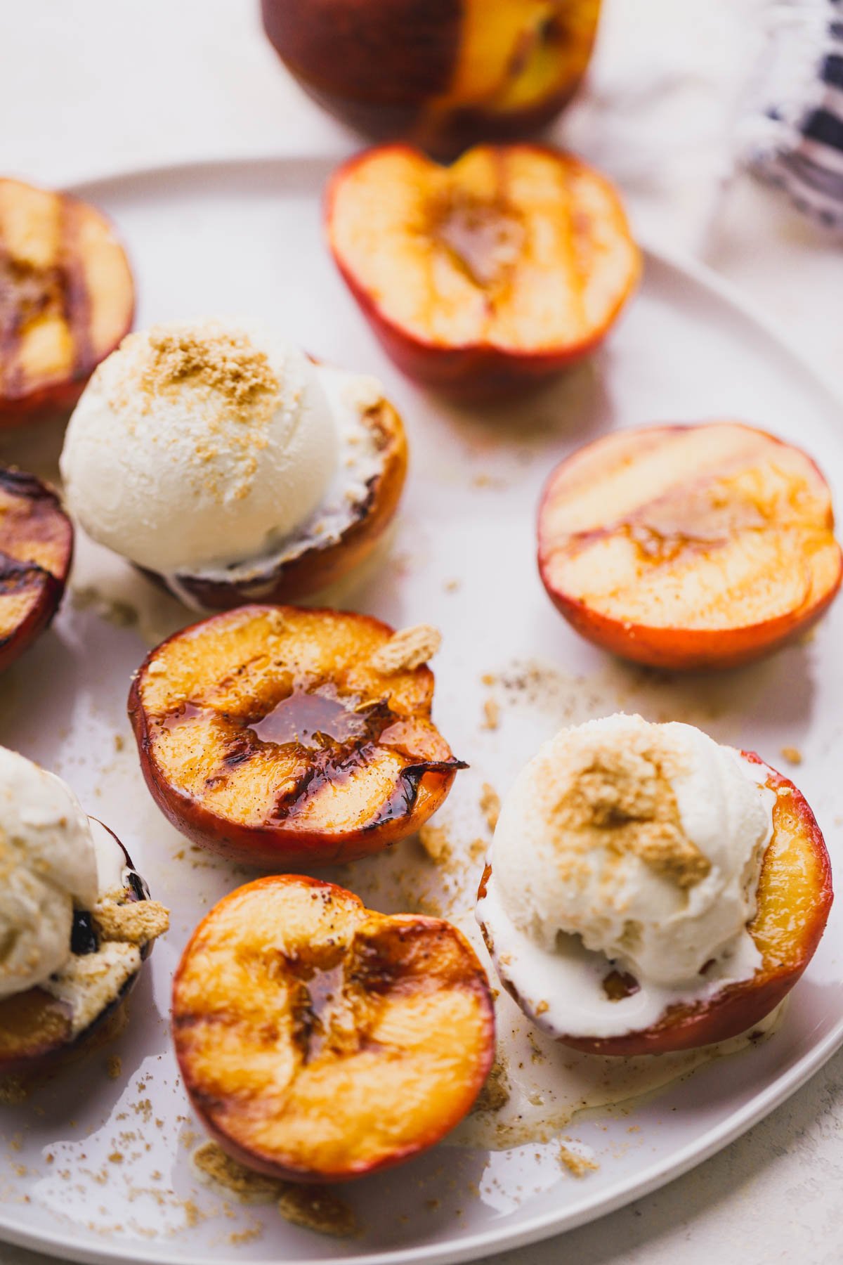 Sweet caramelized peaches topped with vanilla ice cream and crushed Cinnamon Toast Crunch cereal.