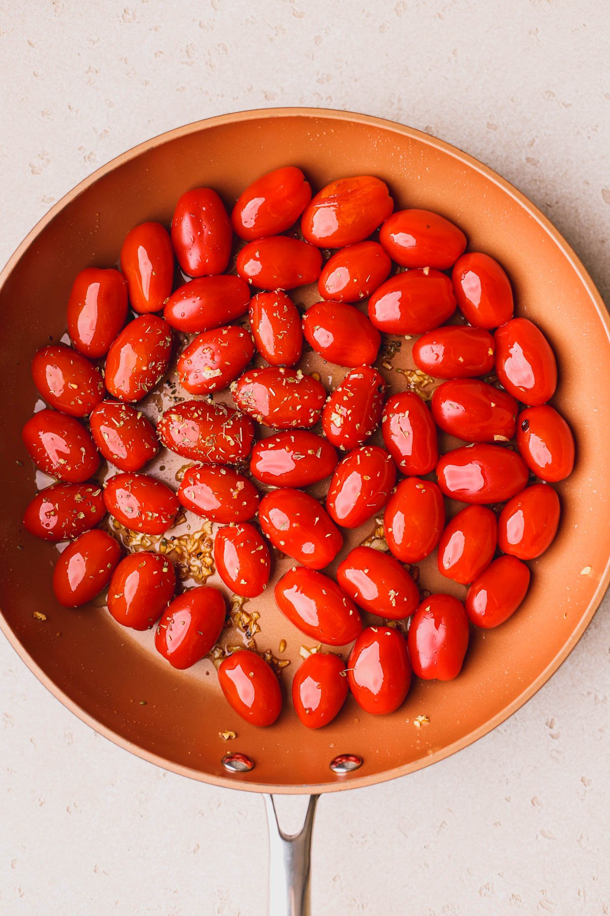 Cherry tomatoes, garlic, red pepper flakes and dried oregano.  