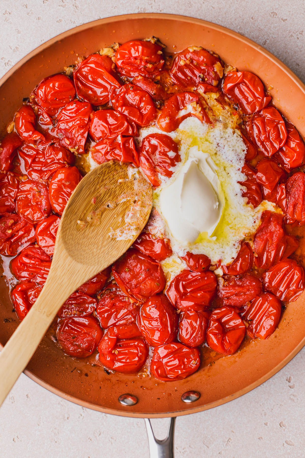 Smashed cherry tomatoes with melted mascarpone cheese. 