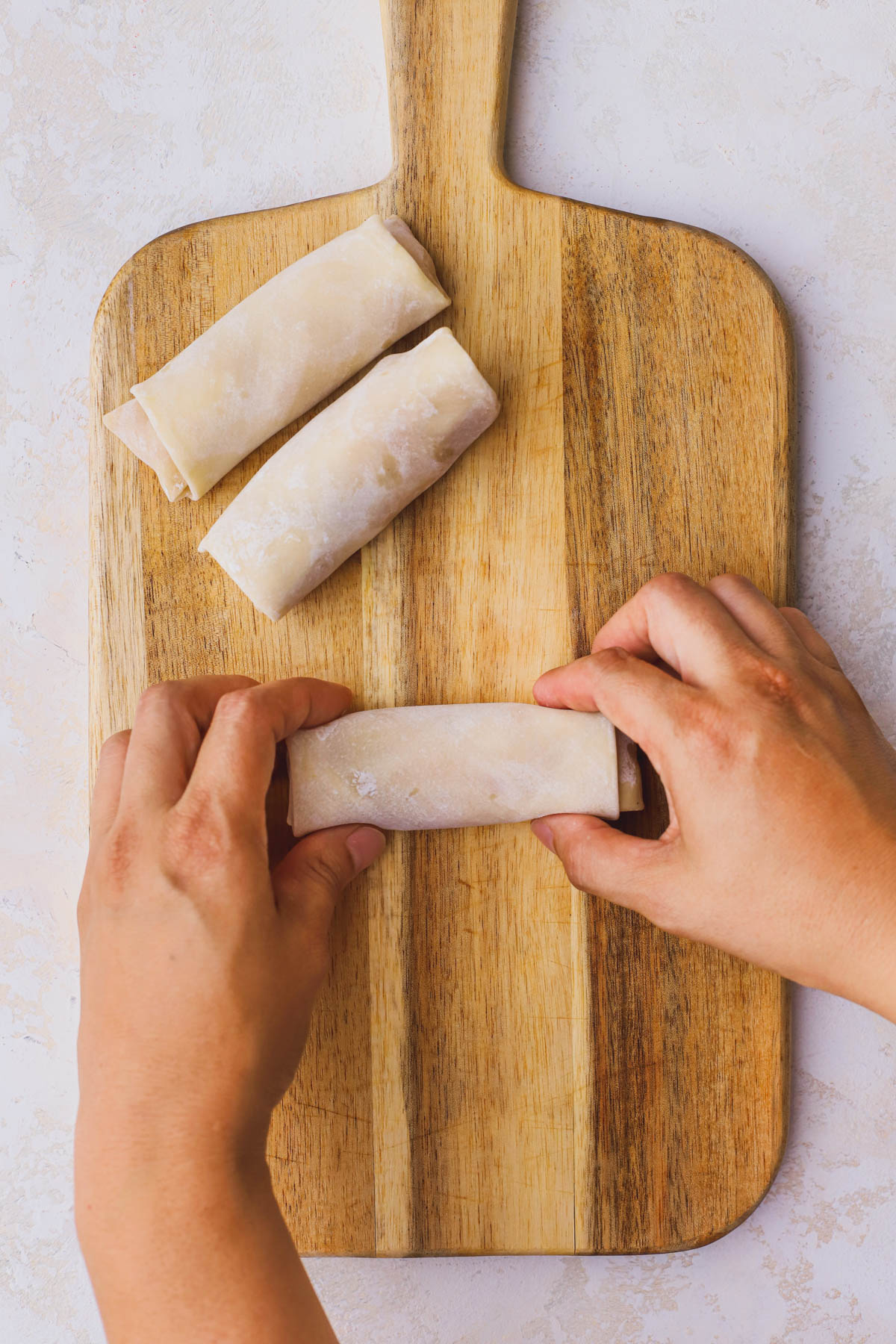 Rolled up peach egg rolls.