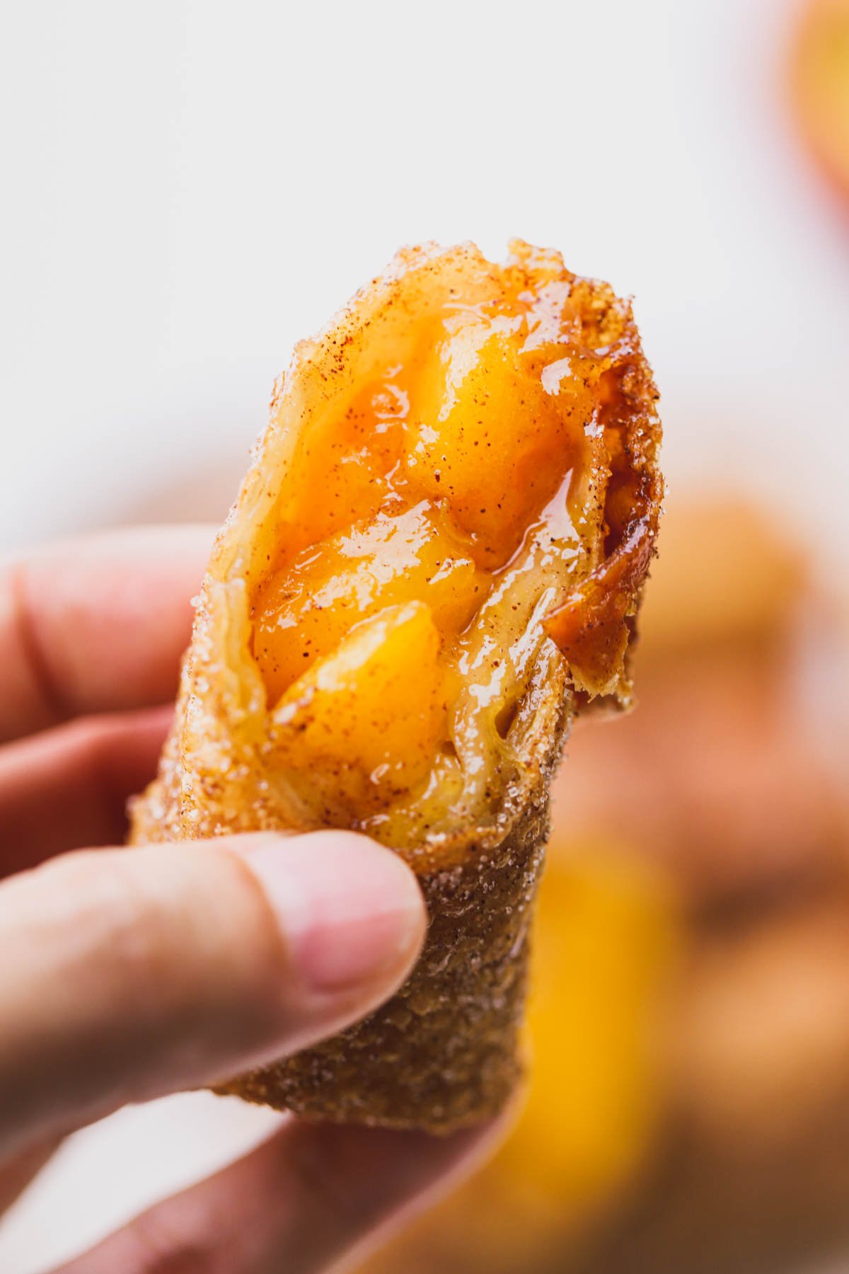 Sliced peach egg roll.