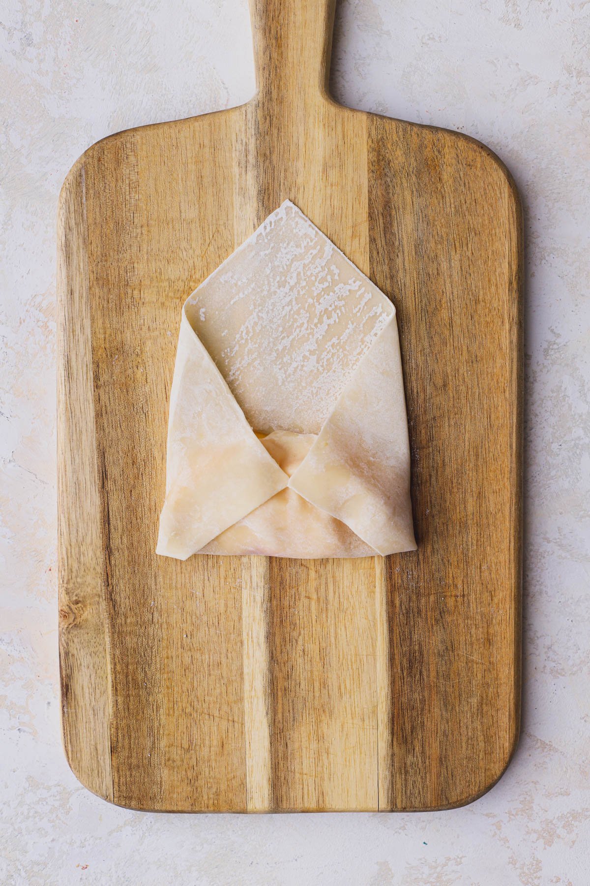 Egg roll with both left and right side folded over.