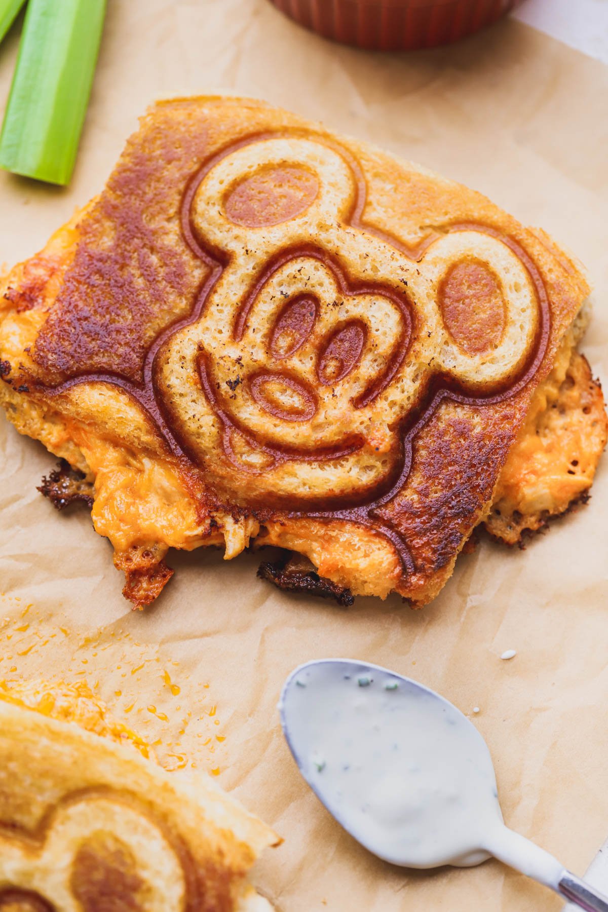 Mickey shaped buffalo chicken grilled cheese served with a homemade blue cheese dressing.  