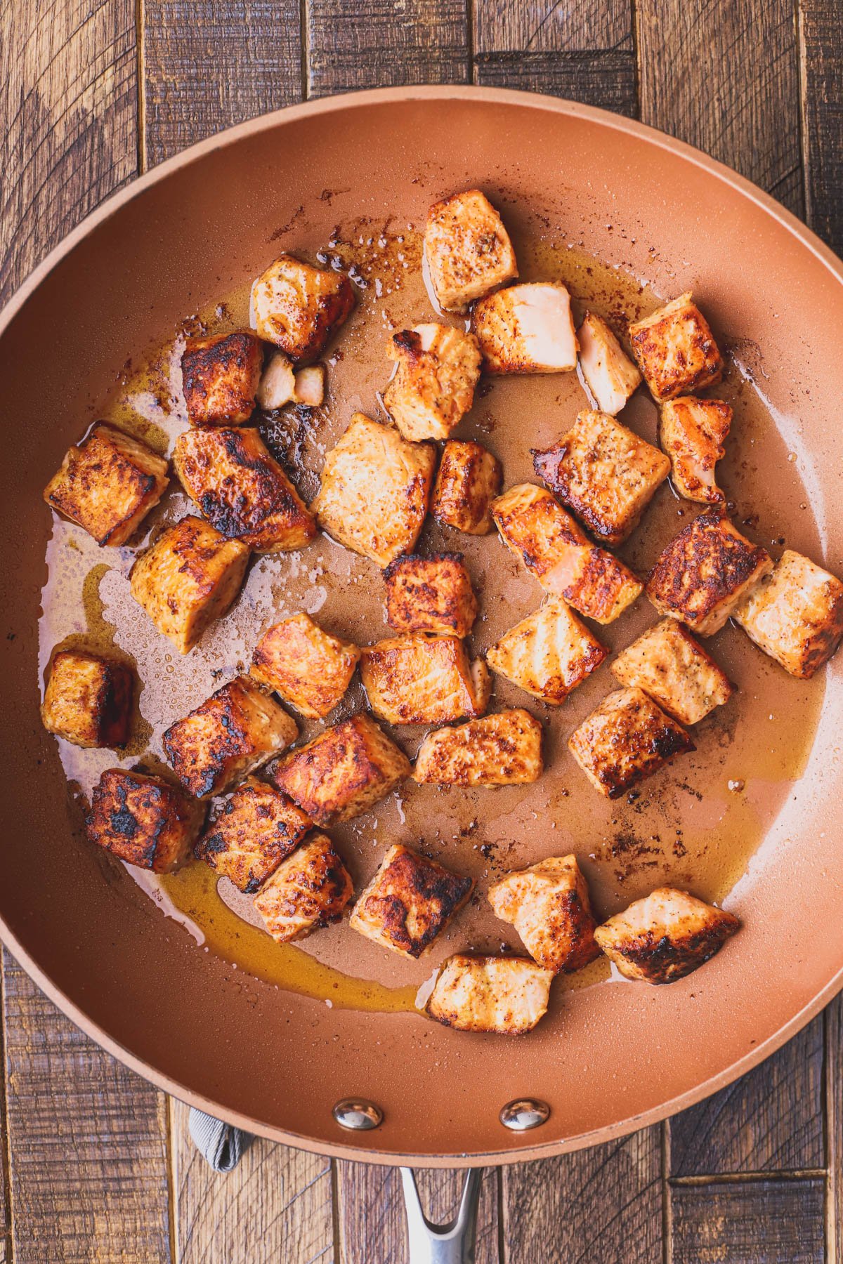 Crispy chunks of salmon sautéed in olive oil.