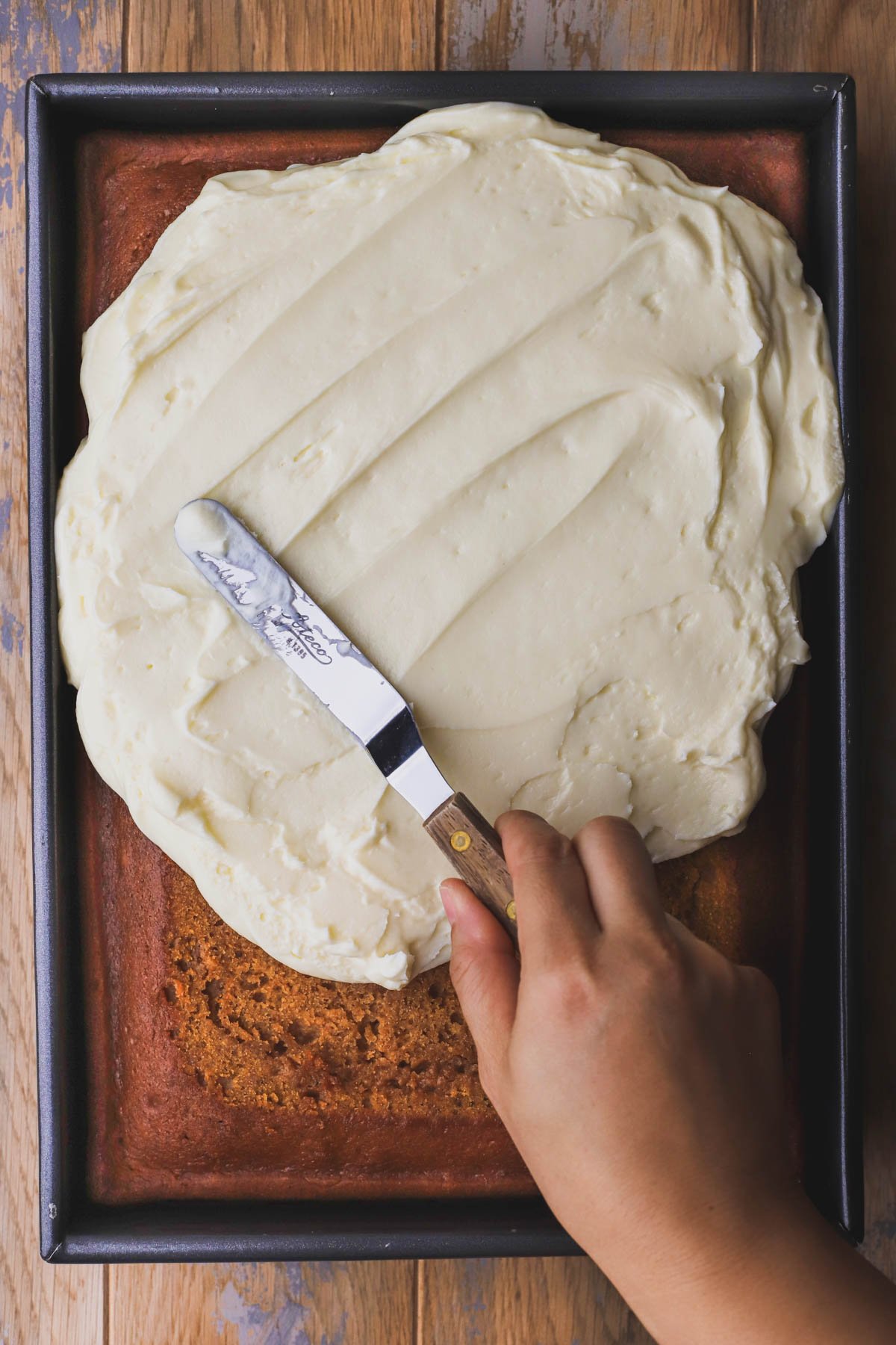 Pumpkin bread topped with homemade cream cheese frosting.