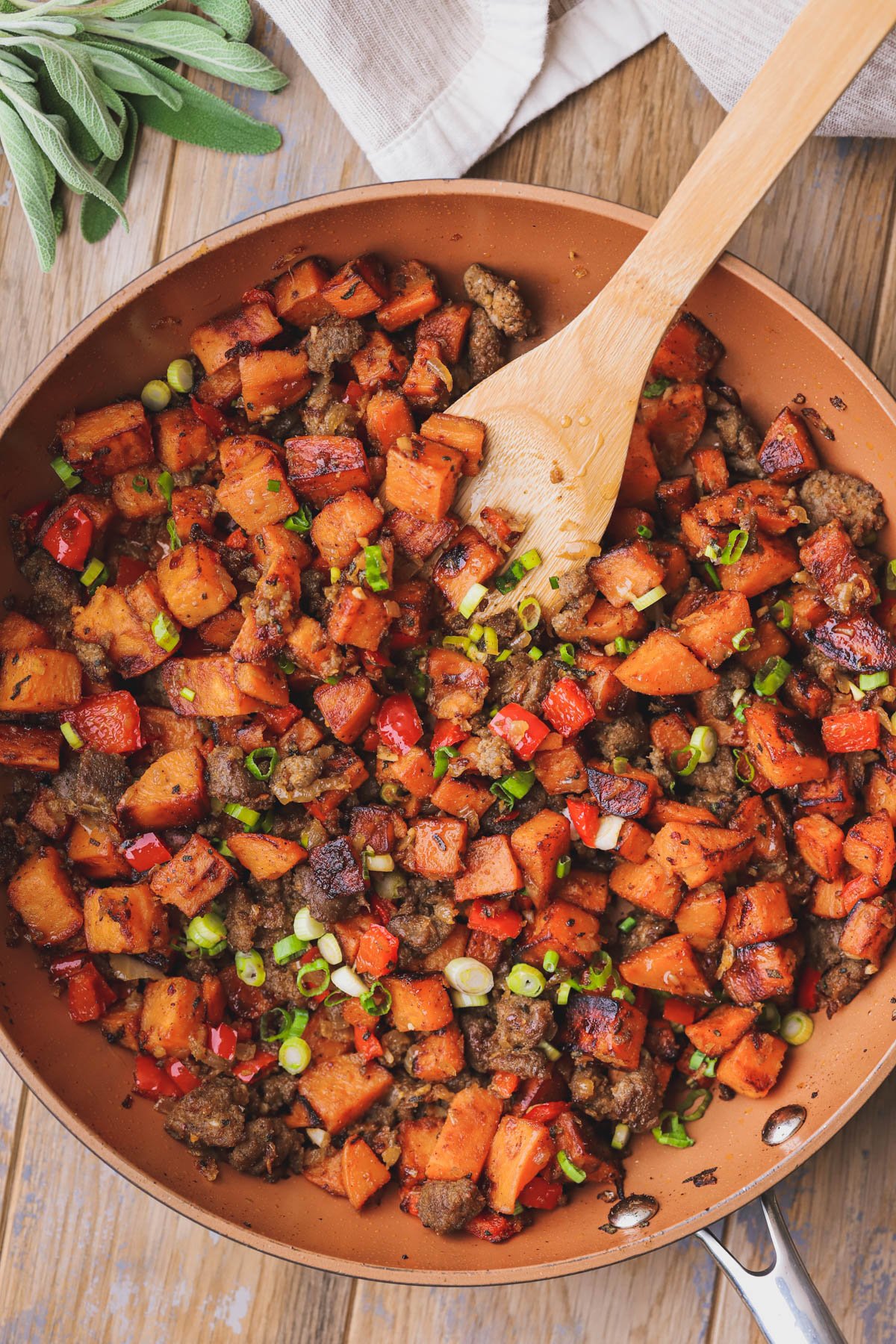 Sweet potato breakfast hash with sautéed onions, turkey sausage and red bell pepper.  