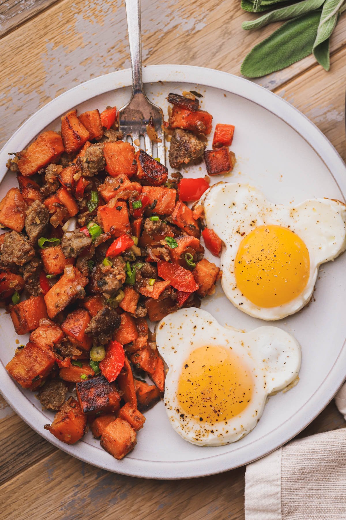 Sweet potato breakfast hash made with turkey sausage, sage, sweet potatoes and caramelized veggies.  