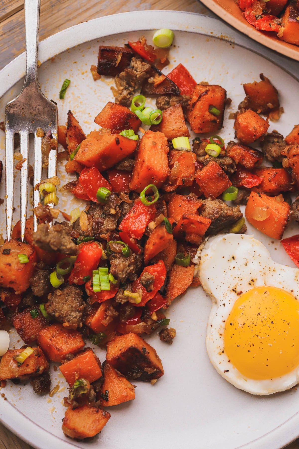 Sautéed sweet potatoes, sausage, bell peppers, sage and green onions.  Served with fried Mickey shaped egg.