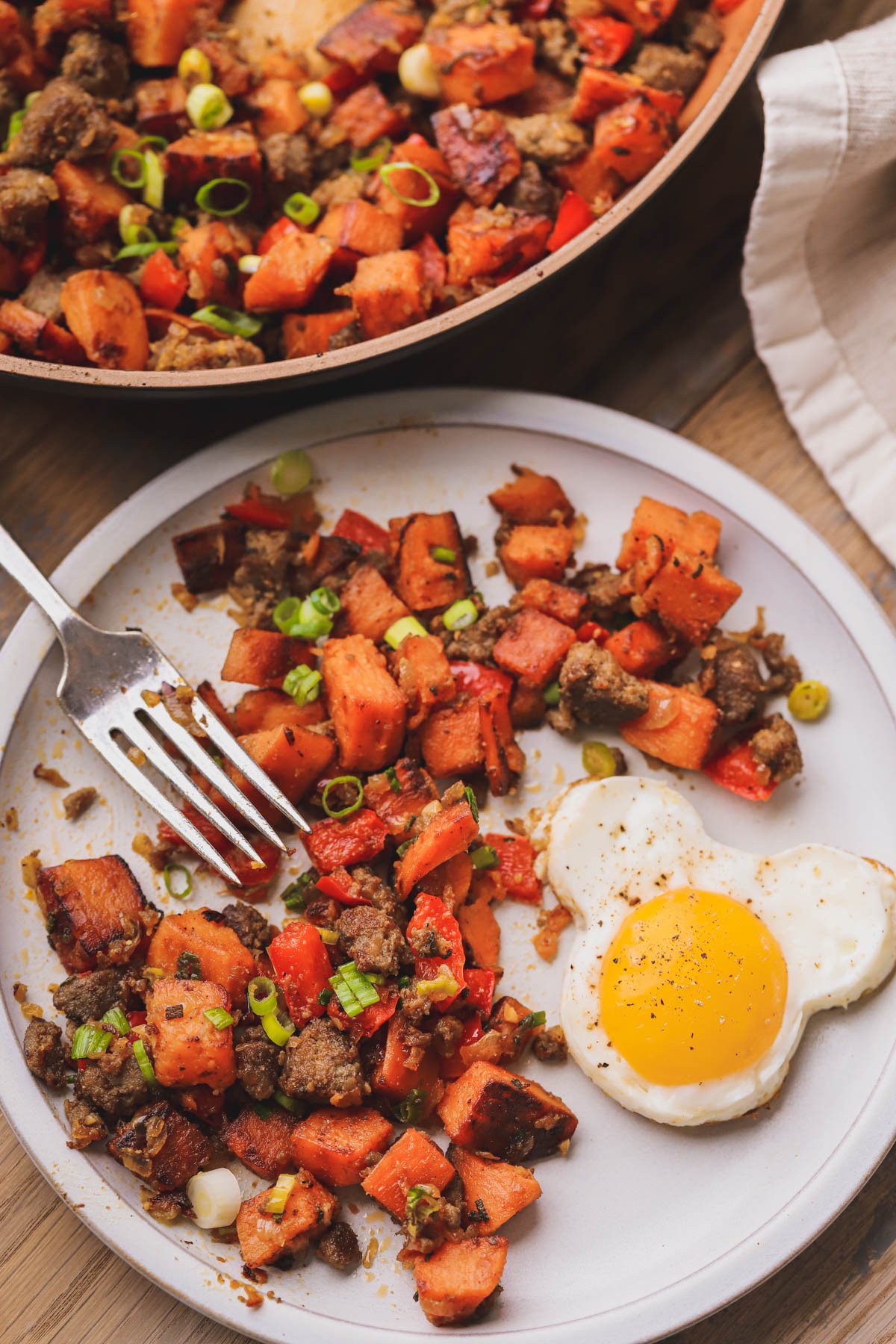 Mickey shaped eggs served with sweet potato breakfast hash.