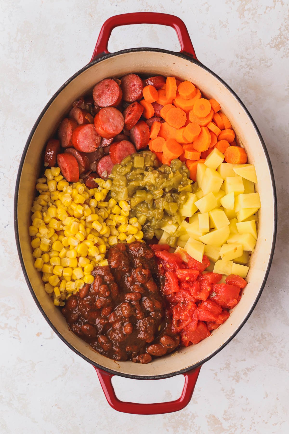 Cowboy beans, gold potatoes, carrots, corn, green chiles, and diced tomatoes.