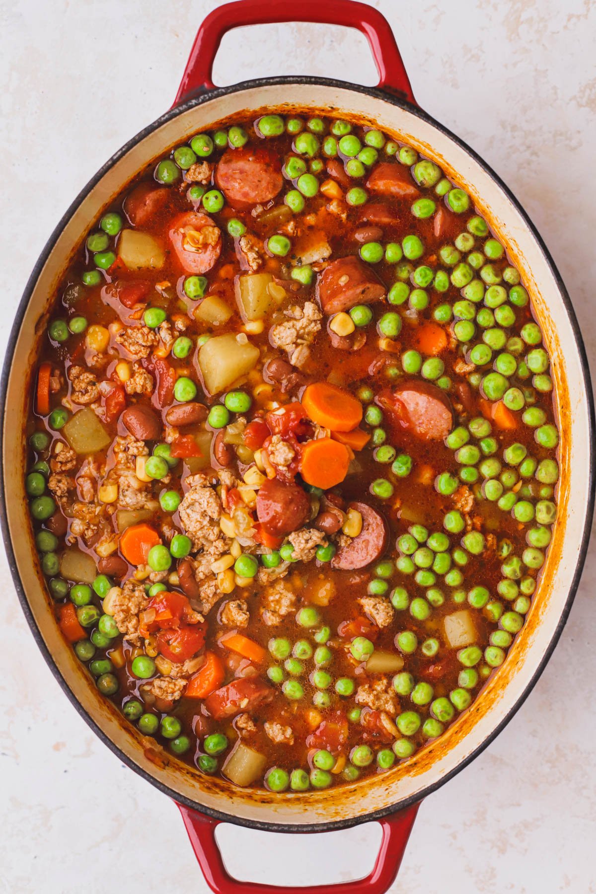 Stewed cowboy soup with ground turkey, sausage, peas, potatoes and tomato broth.  