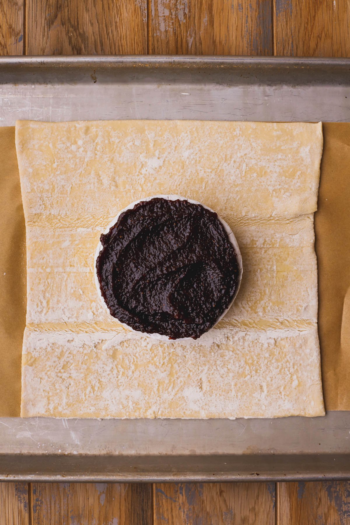 Puff pastry sheet, brie topped with fig jam.