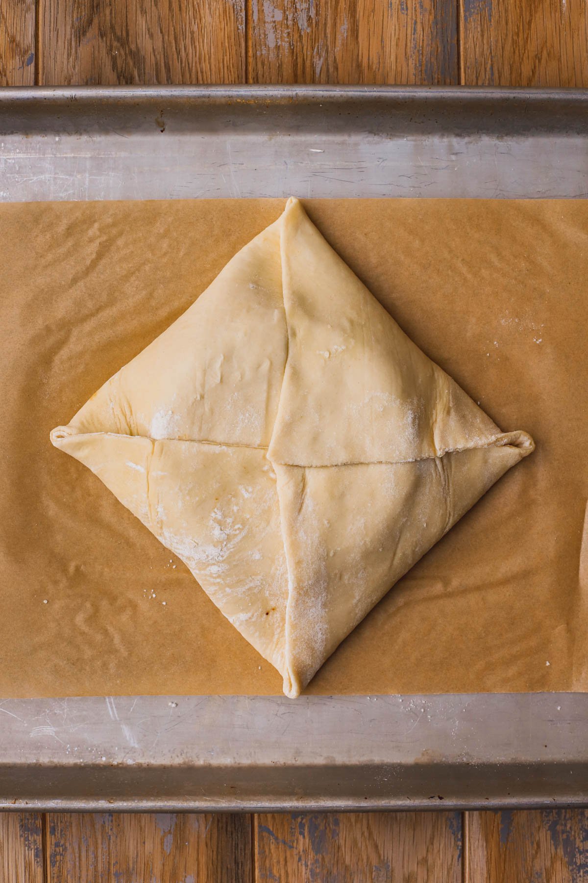 Folded puff pastry with brie cheese and fig jam inside.