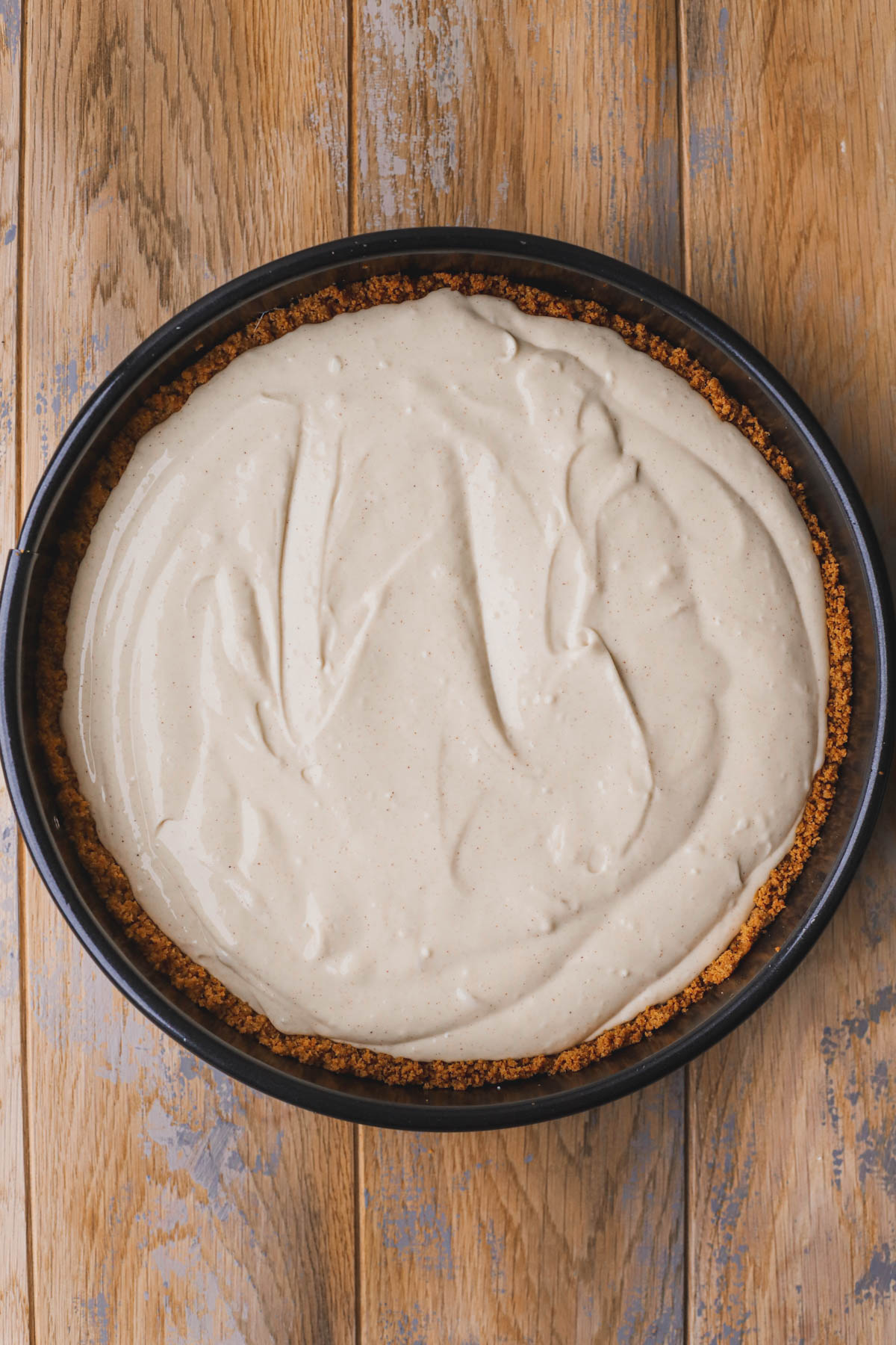 Baked graham cracker crust filled with cheesecake batter.  