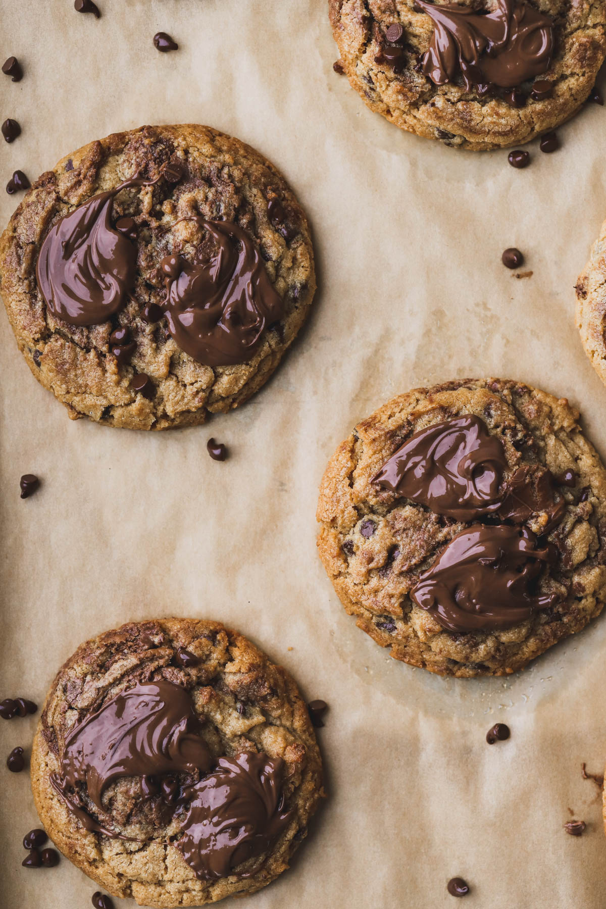 Baked peanut butter Nutella cookies with dollops of melted Nutella on top.  
