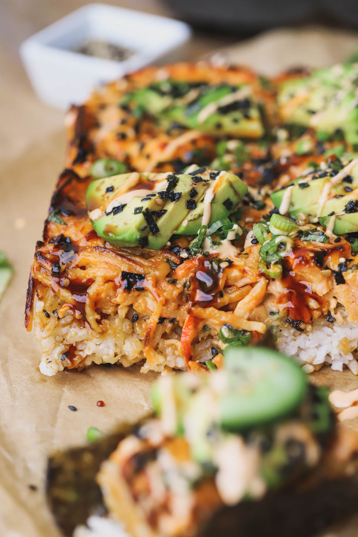 Spicy salmon sushi bake with unagi sauce, spicy mayo, and avocados.  