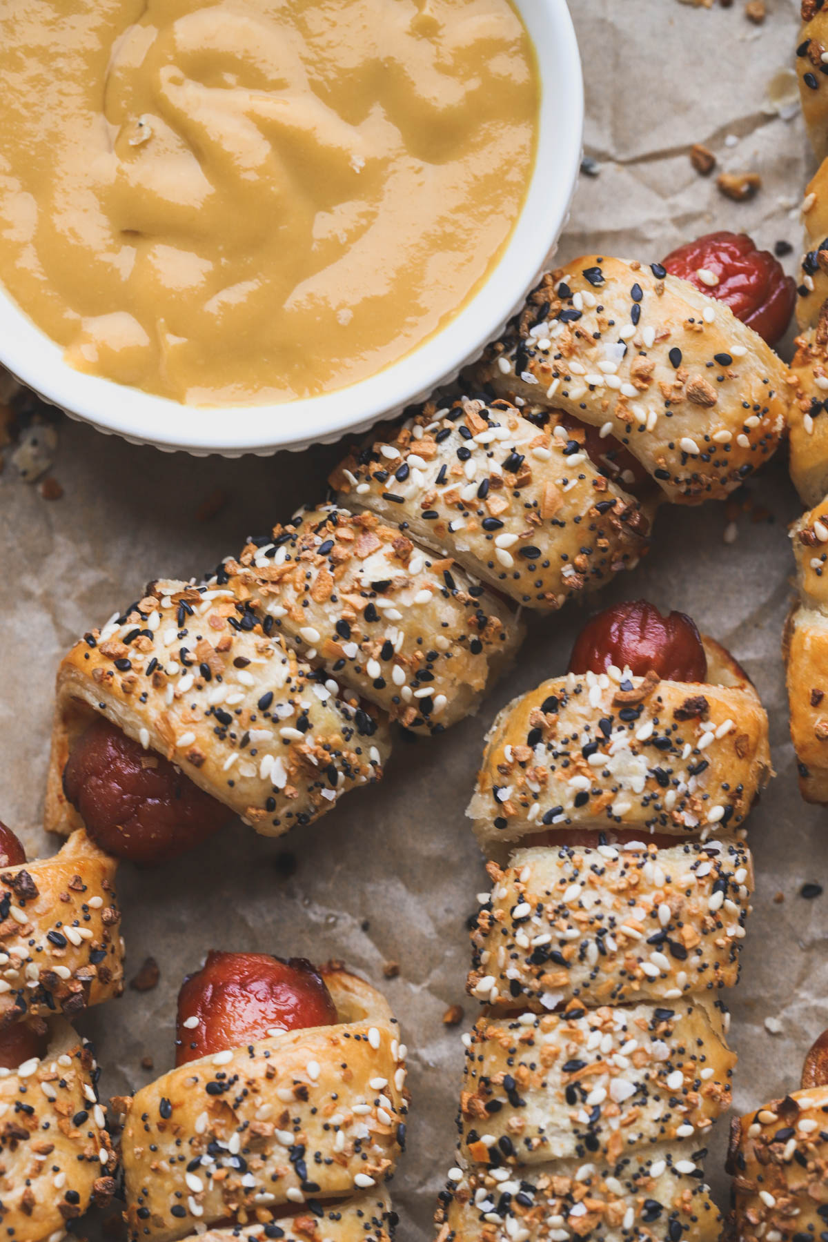 Puff pastry hot dogs with everything bagel seasoning, honey mustard sauce. 