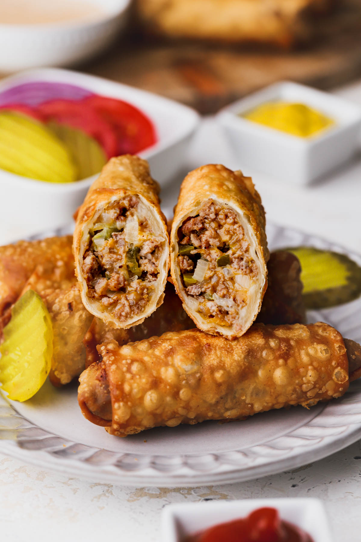 Egg roll wrappers filled with cheeseburger filling.  