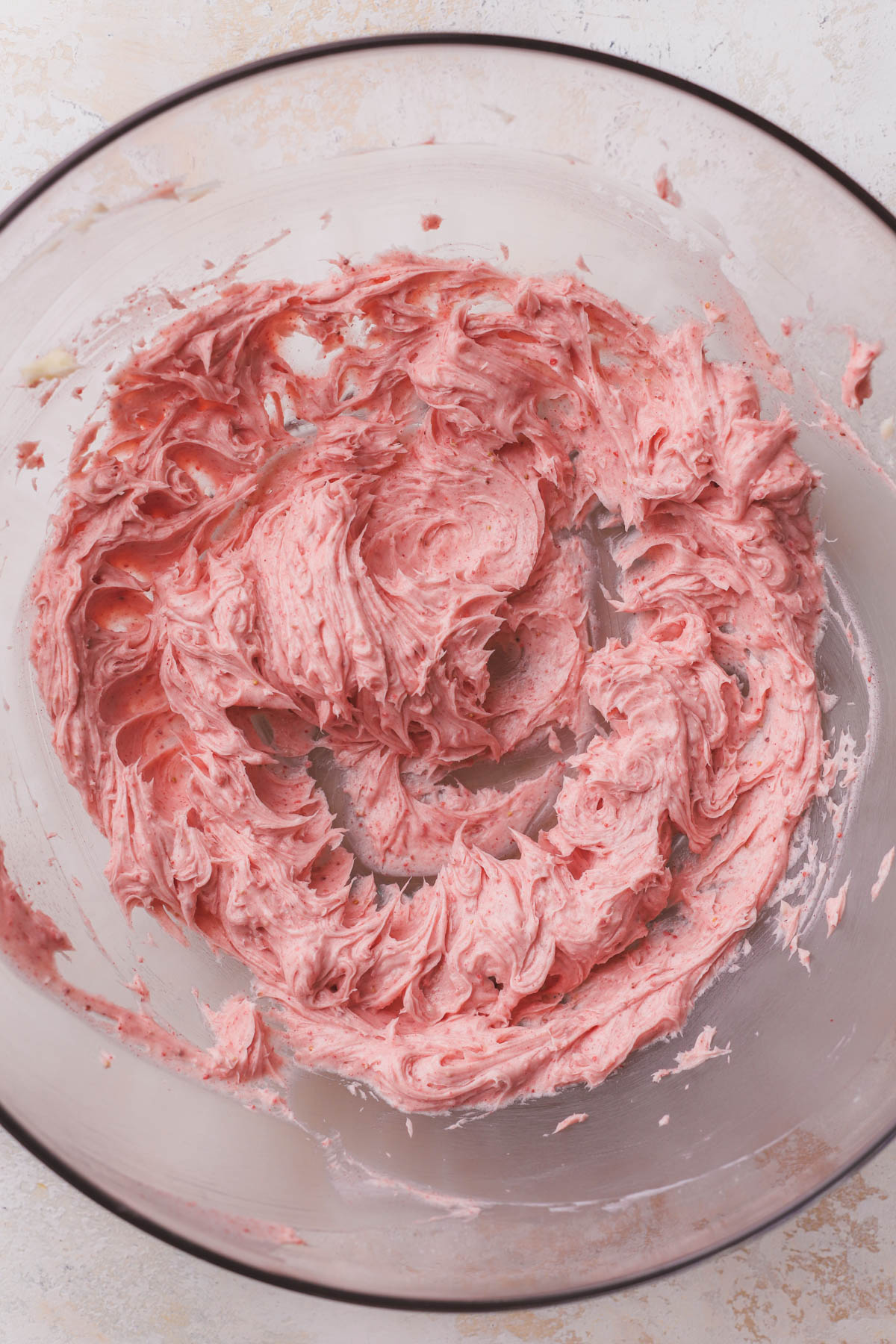 Creamed butter with freeze dried strawberry powder. 