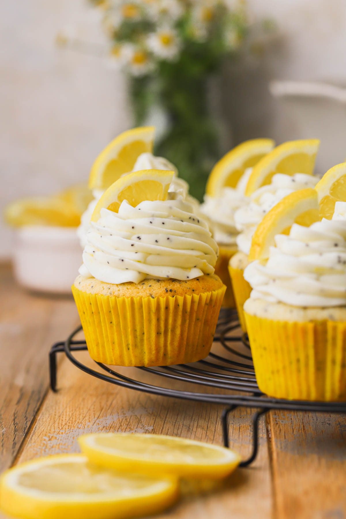 Lemon cupcakes with poppyseeds and cream cheese frosting.  