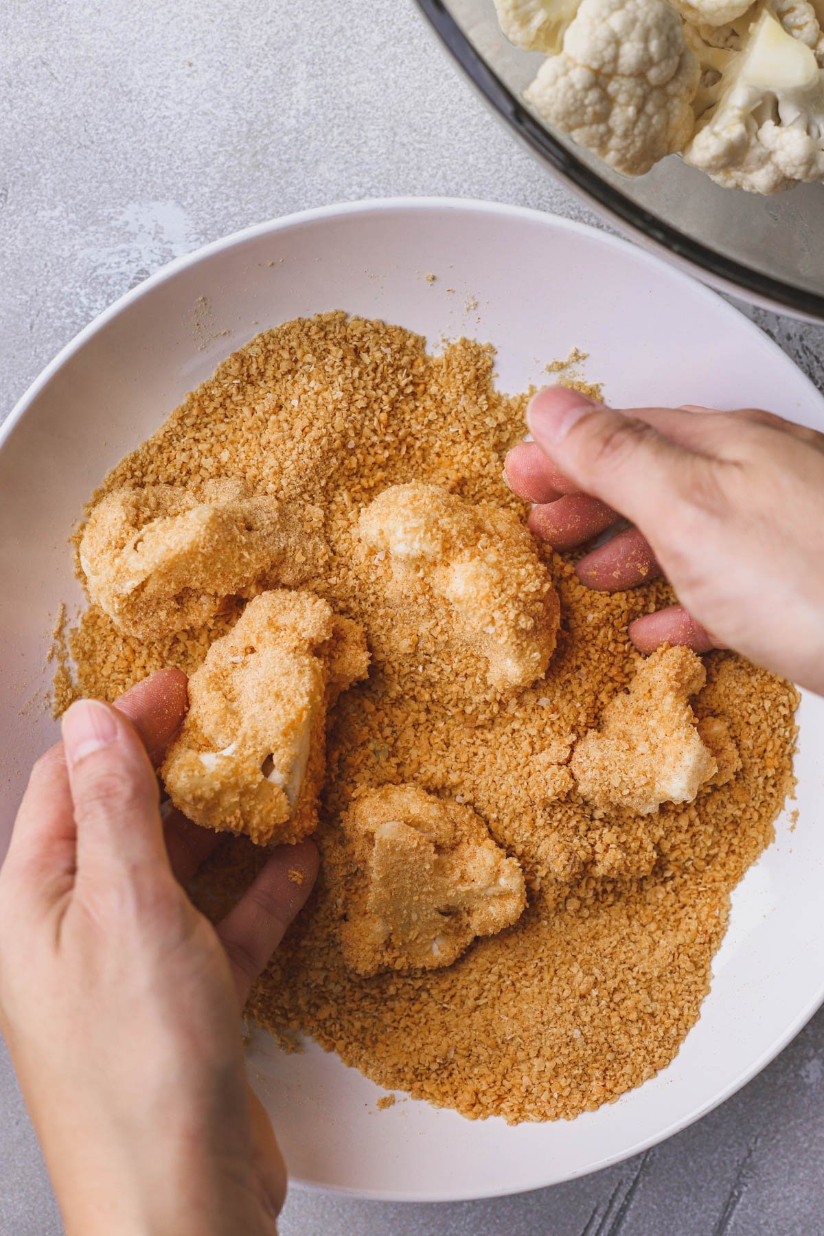 Cauliflower coated in ground cornflakes.  