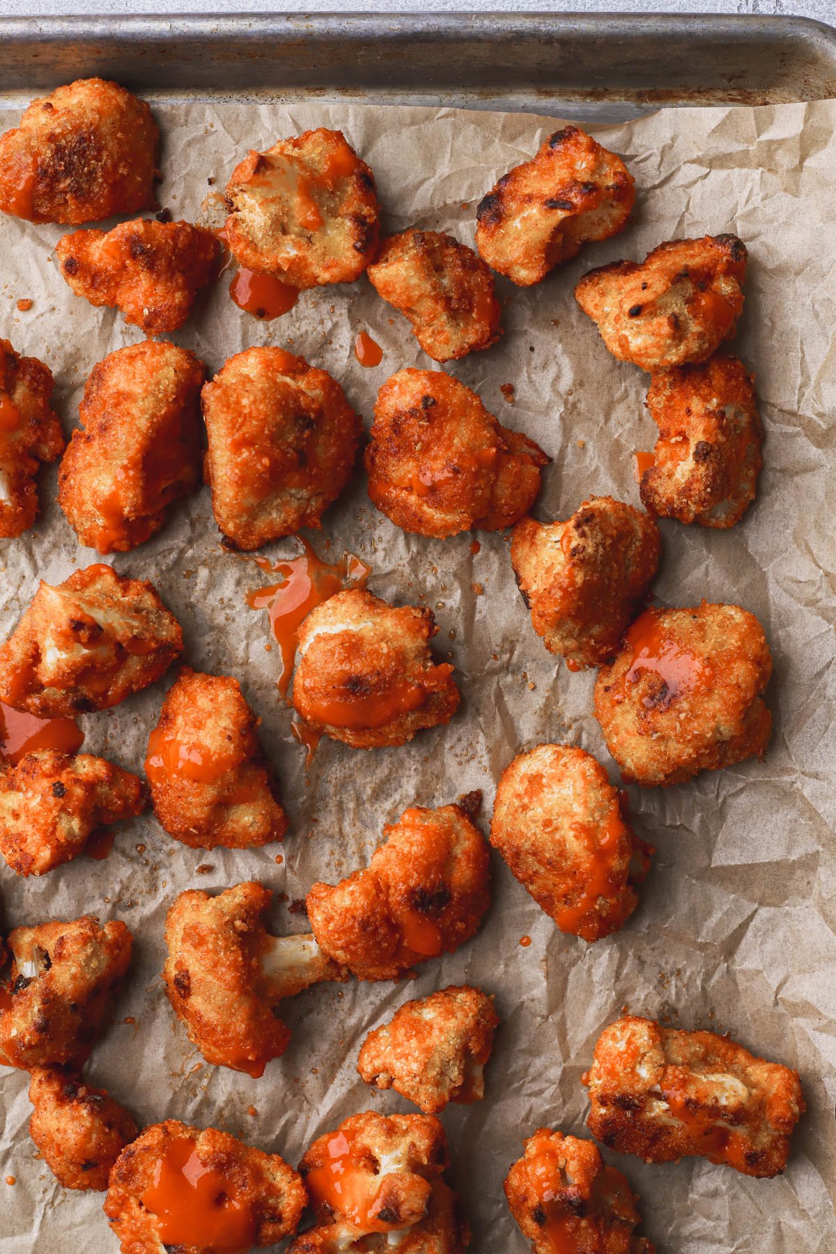 Baked cornflake coated cauliflower and tossed with buffalo sauce.  