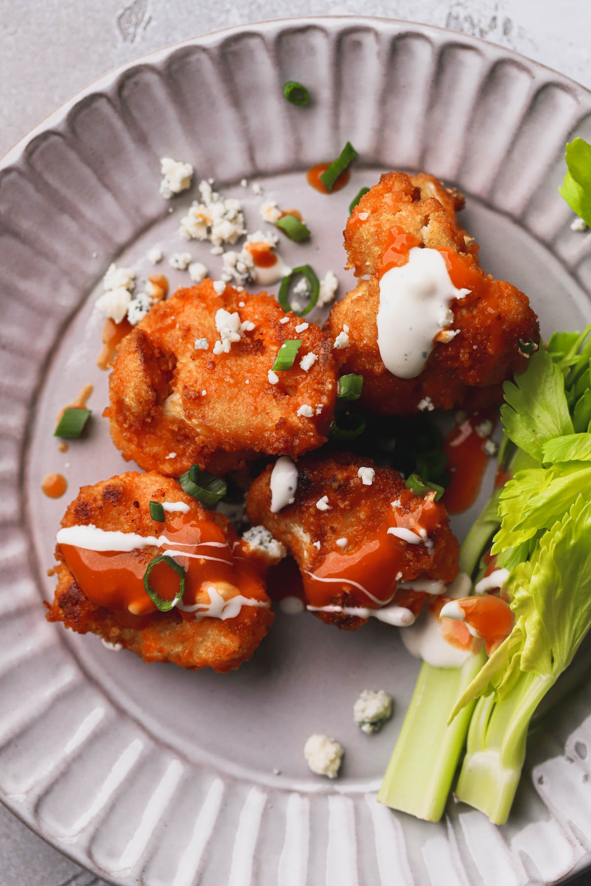 Buffalo crispy cauliflower bites, ranch dressing, celery sticks and blue cheese.  