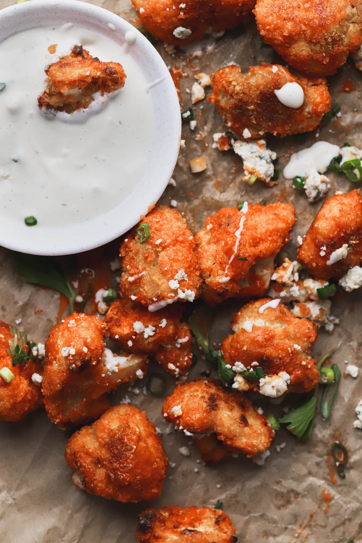 Crispy cauliflower bites tossed in buffalo sauce, blue cheese and green onions.  