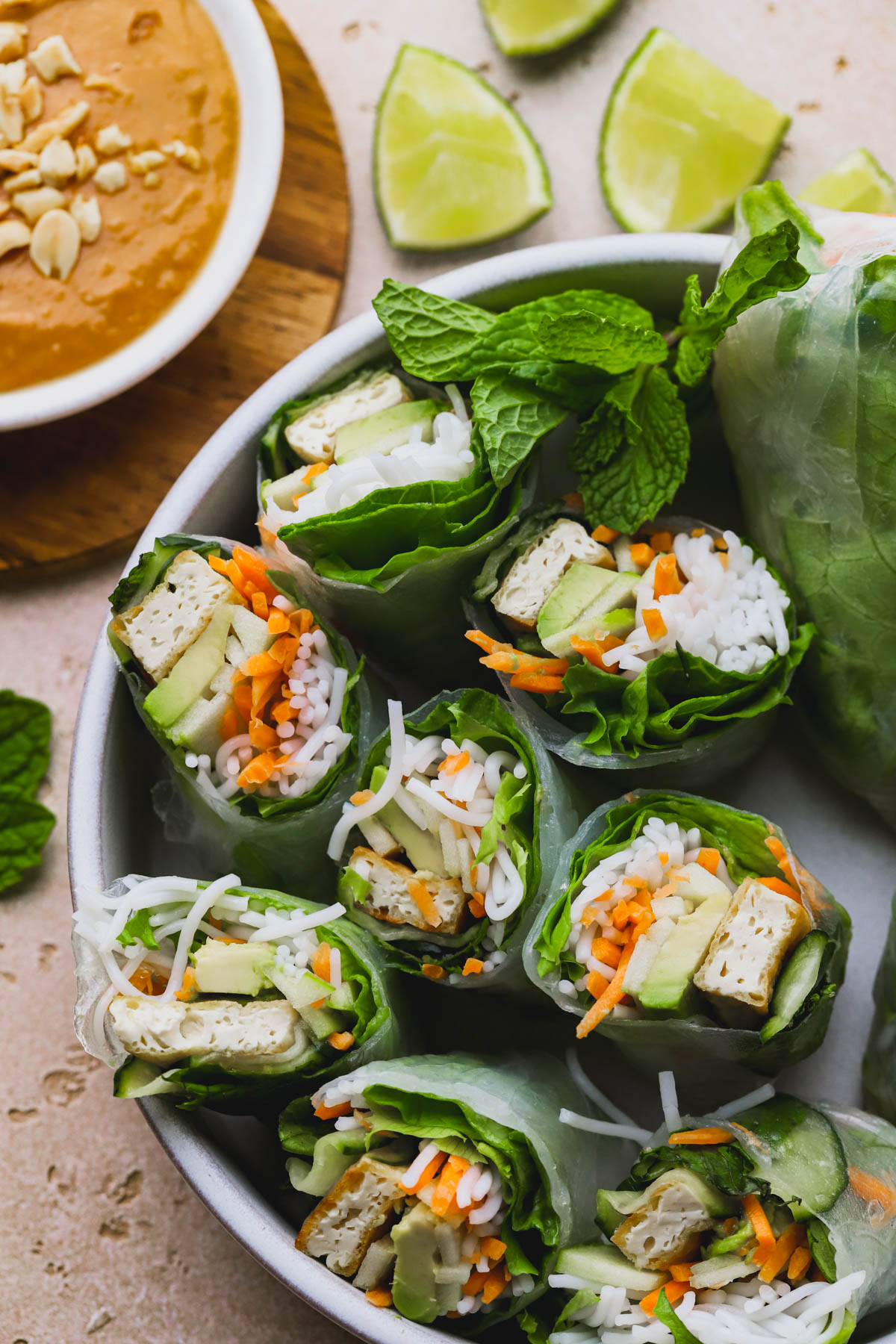 Summer rolls with tofu, pickled cucumber, avocado, rice noodles and fresh mint. 