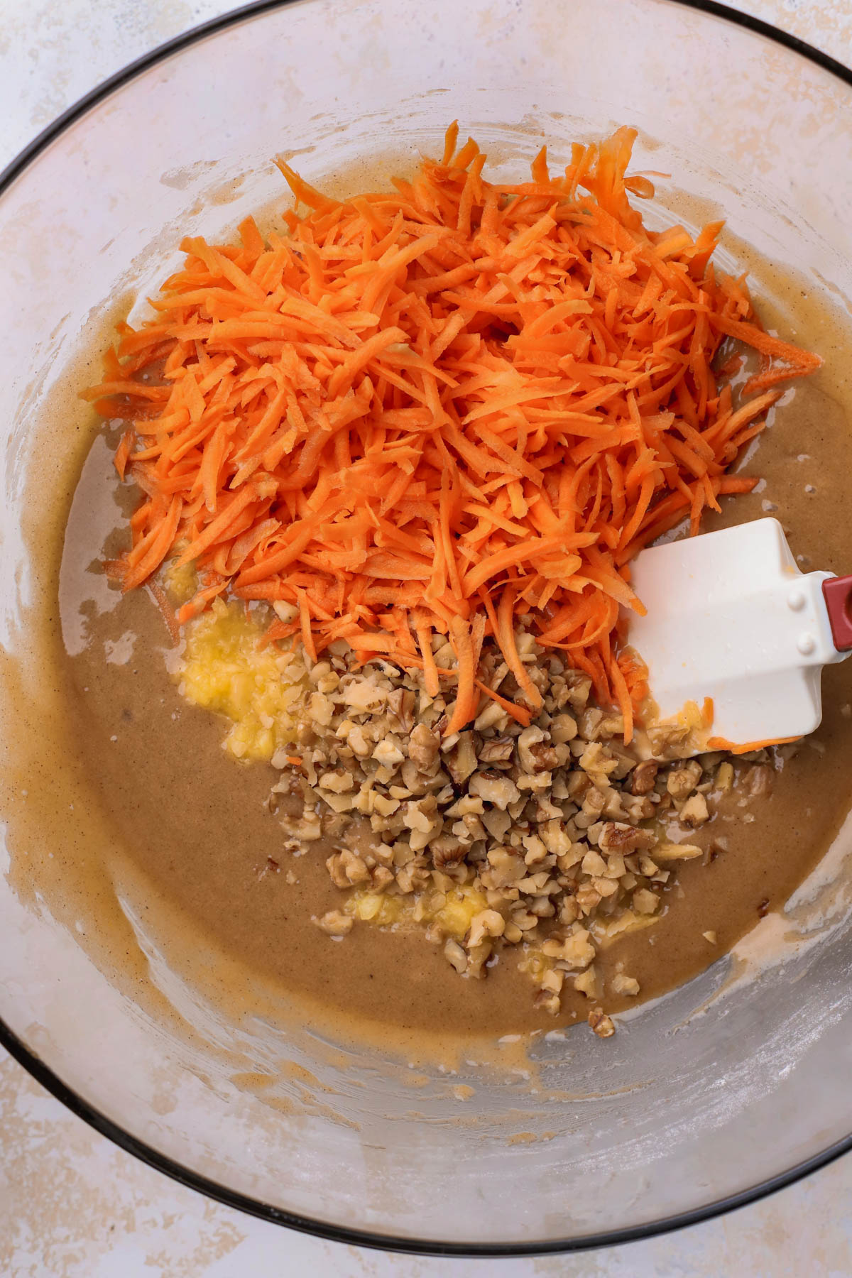 Cake batter, crushed pineapple, shredded carrots and walnuts. 