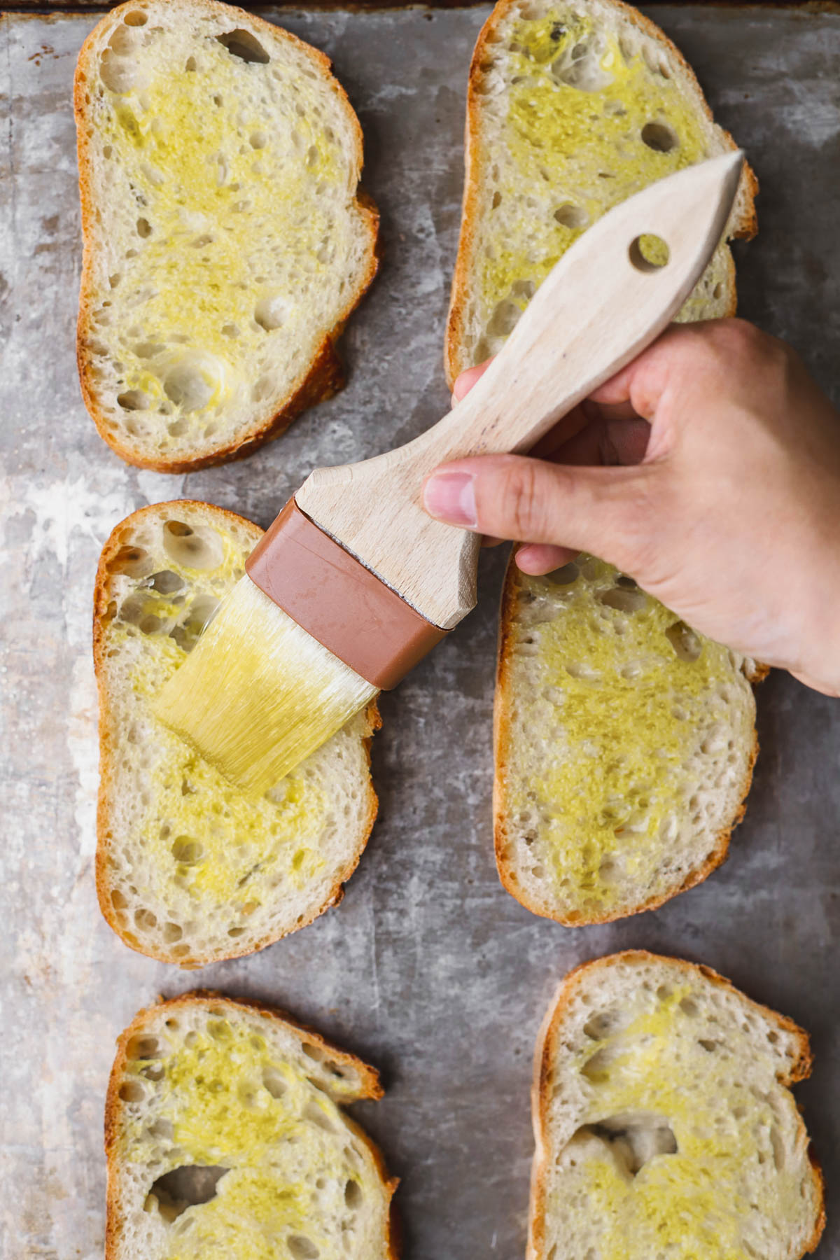 Sliced bread brushed with olive oil. 