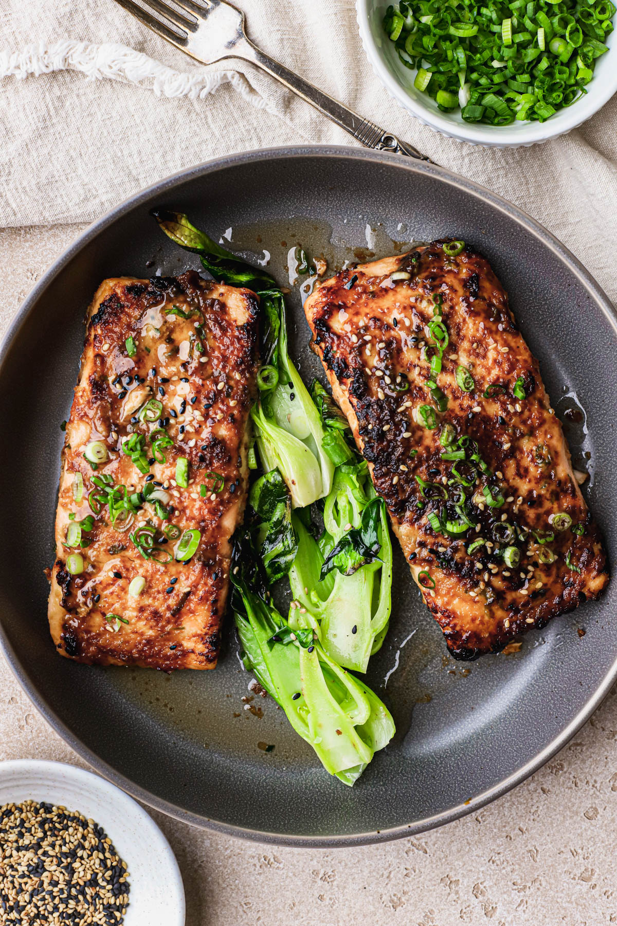 Cooked salmon fillets with miso, garlic, ginger, green onions and bok chow. 