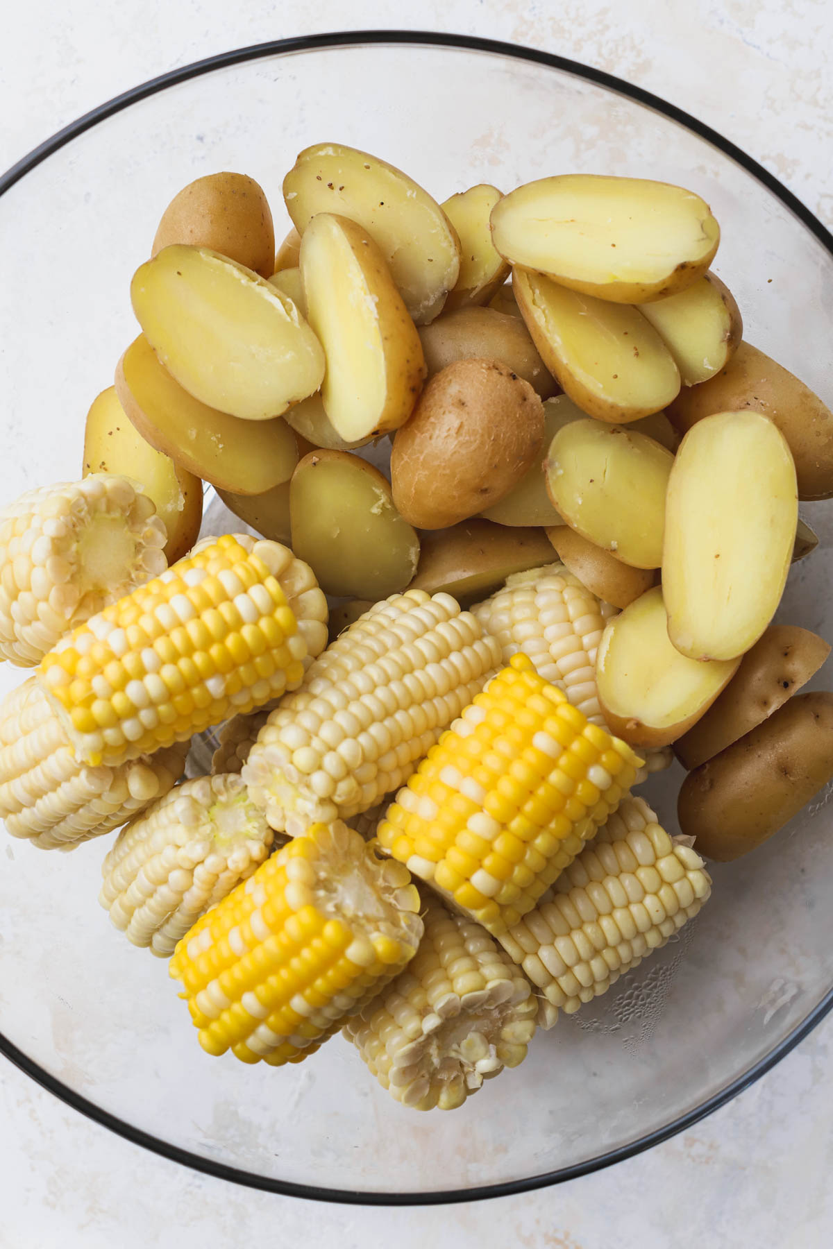 Boiled potatoes and corn on the cob. 