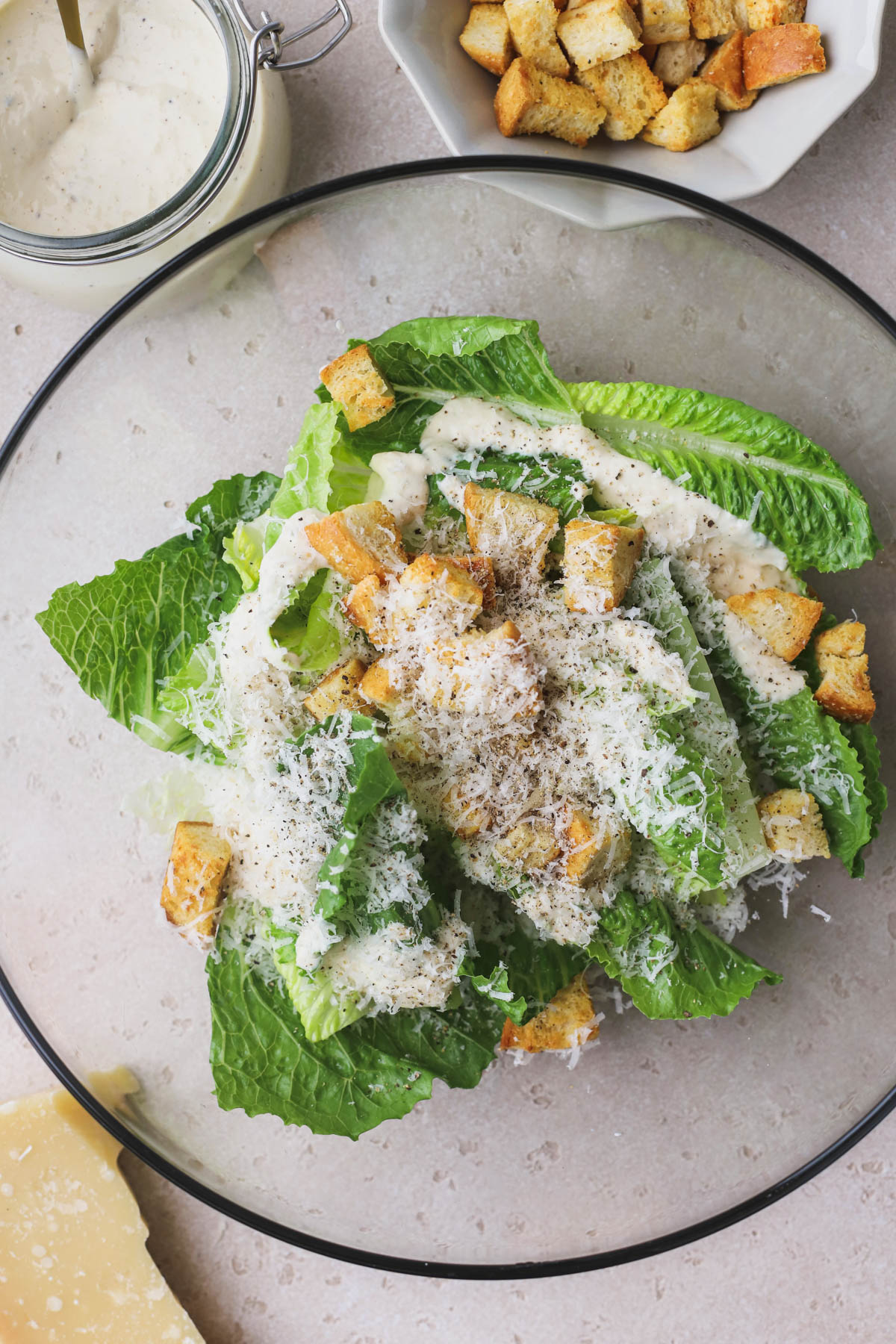Caesar salad dressing without anchovies, romaine lettuce, croutons and parmesan cheese. 