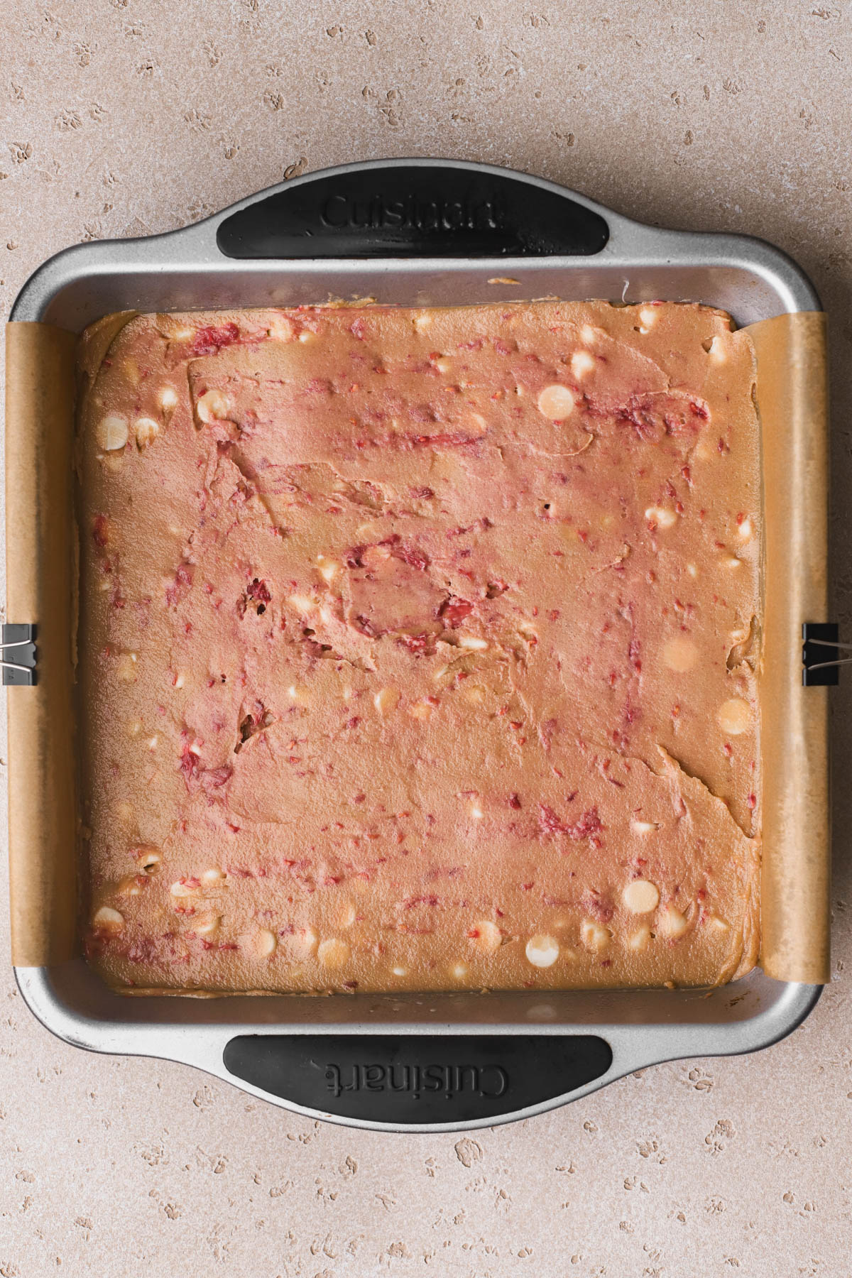 Blondies with raspberries in 8x8 baking pan. 