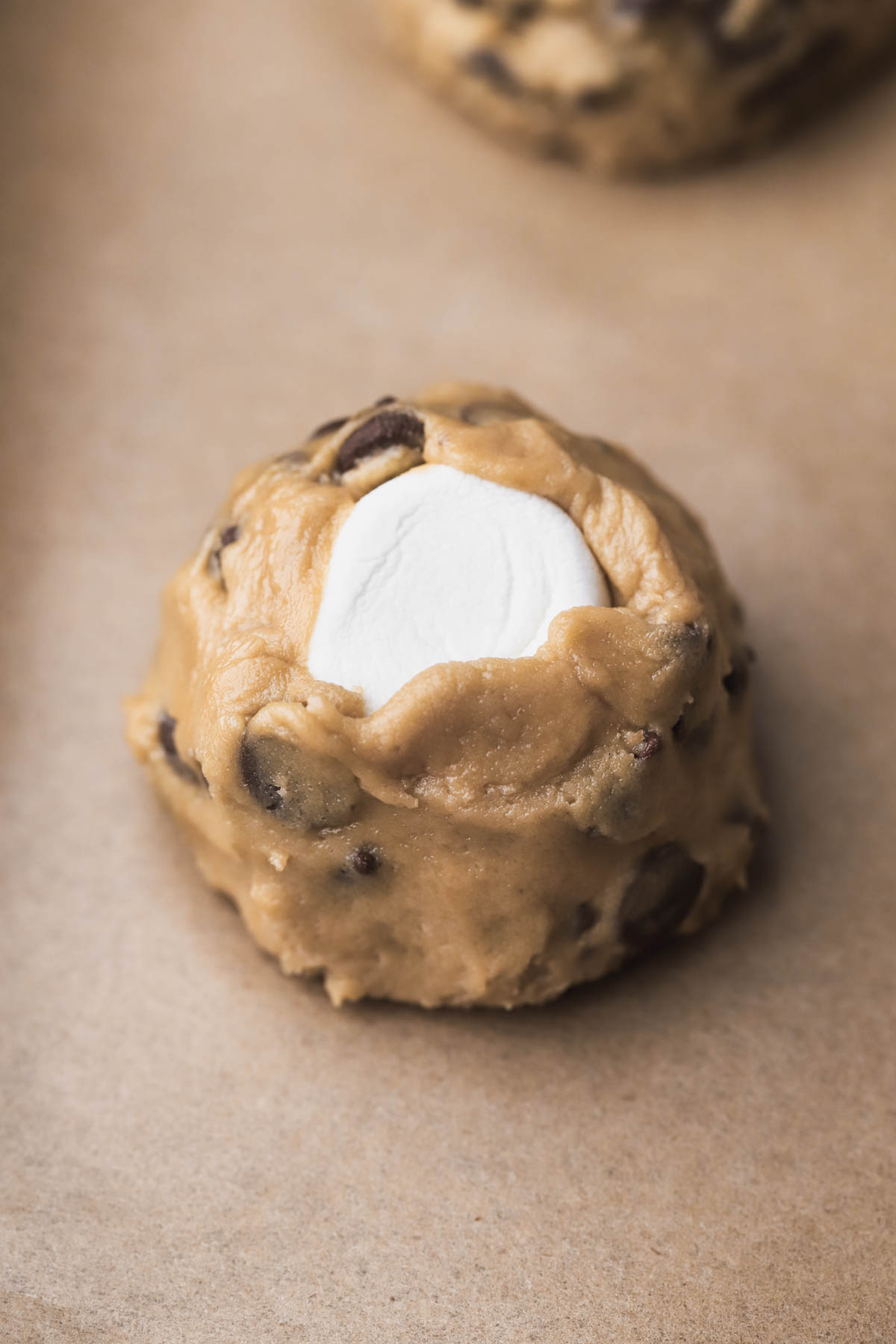 Scooped cookie stuffed with marshmallow.  