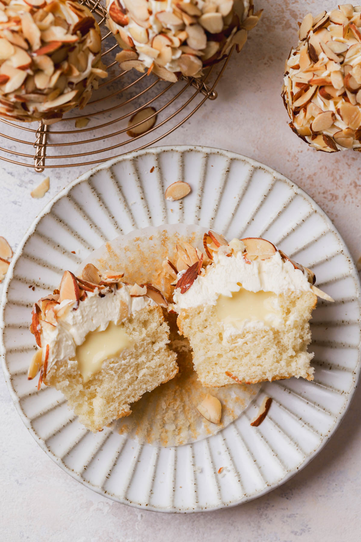 Cupcake flavored with almond extract, filled with vanilla custard, German buttercream and toasted almonds.  