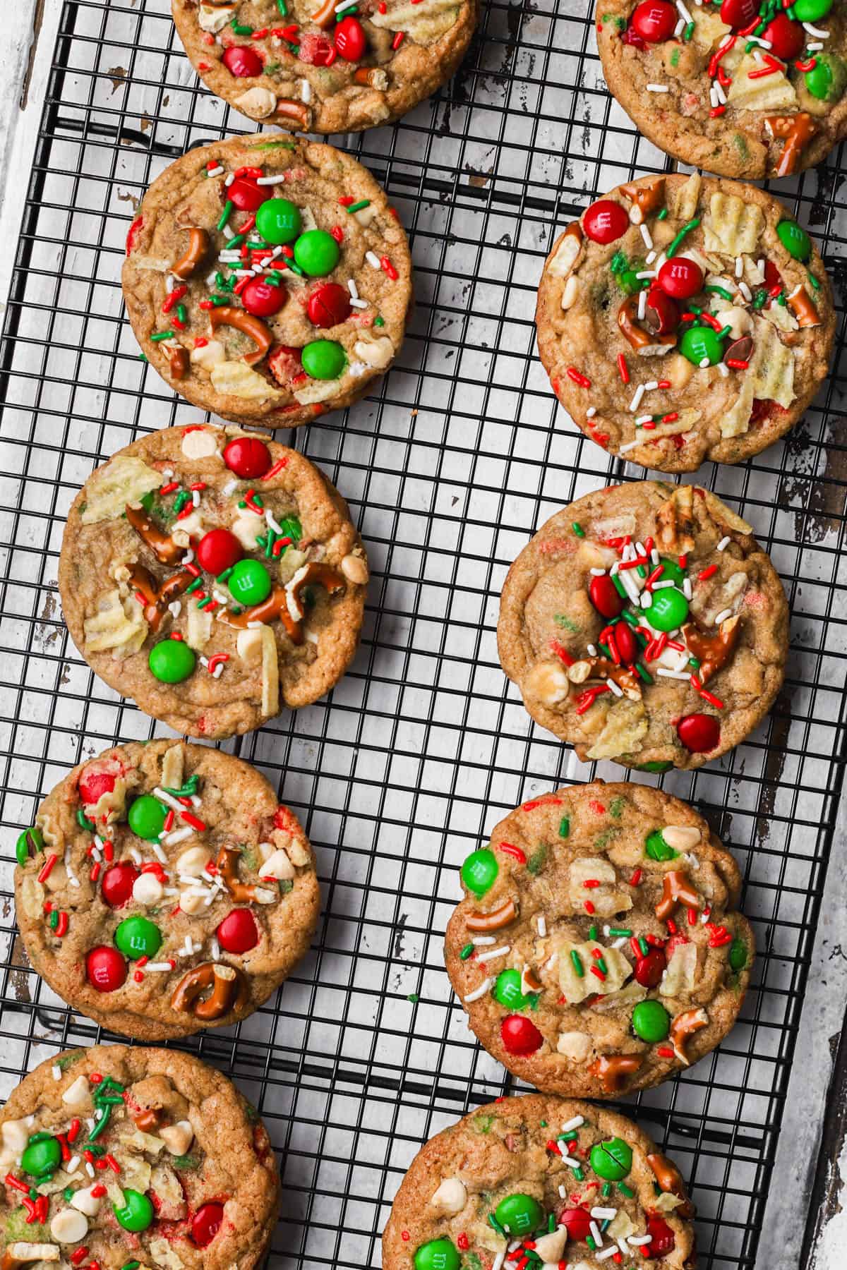 Baked kitchen sink Christmas cookies with pretzels, potato chips, white chocolate and M&M's.